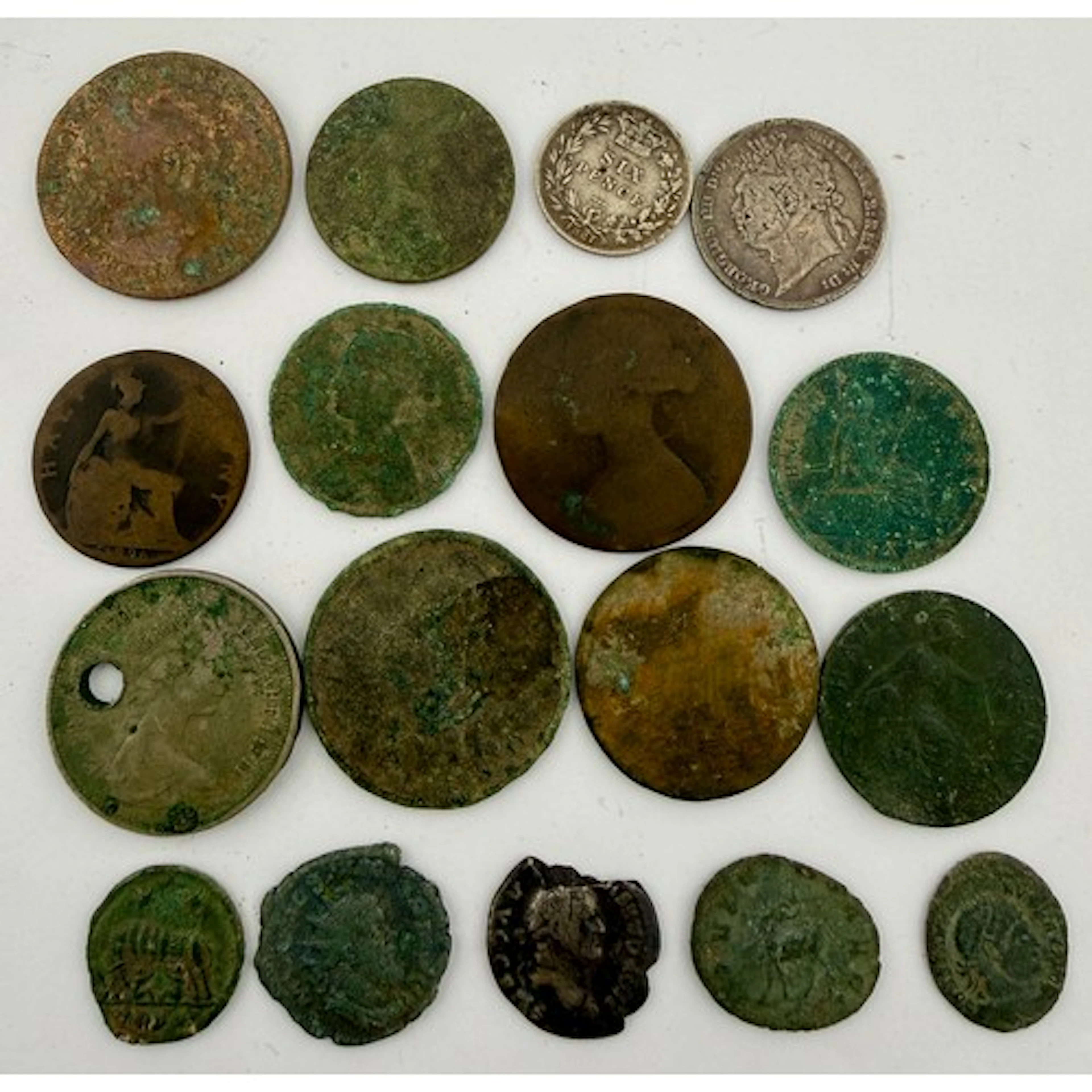Various coins to include Roman and silver.