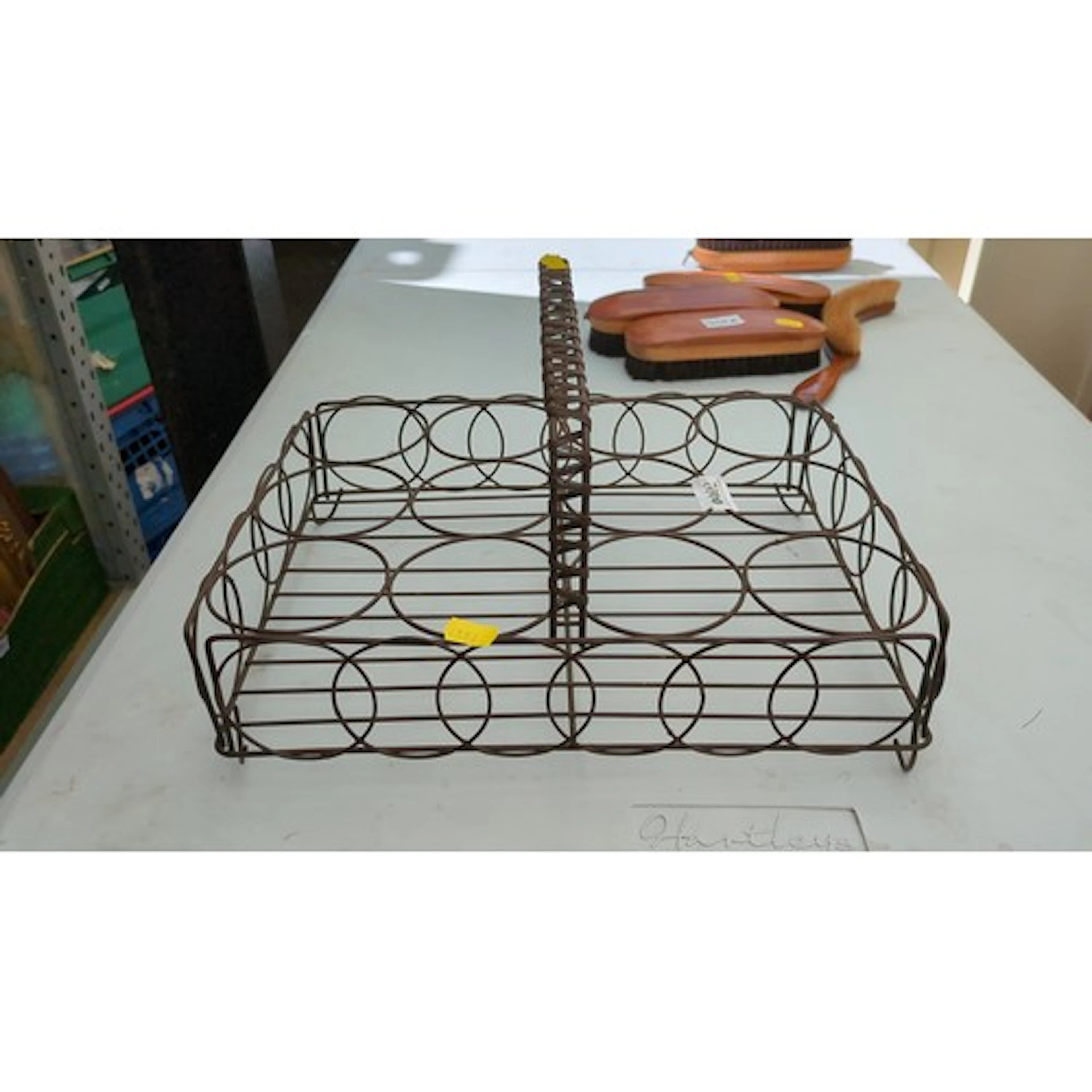 Metal bottle carrier, of rectangular form with a central wra...