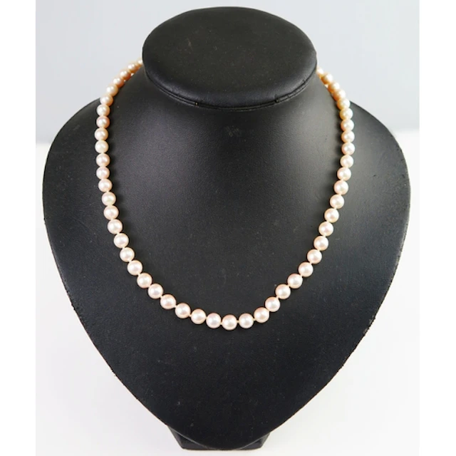 A Mikimoto cultured pearl necklace with a 14K yellow gold cl...