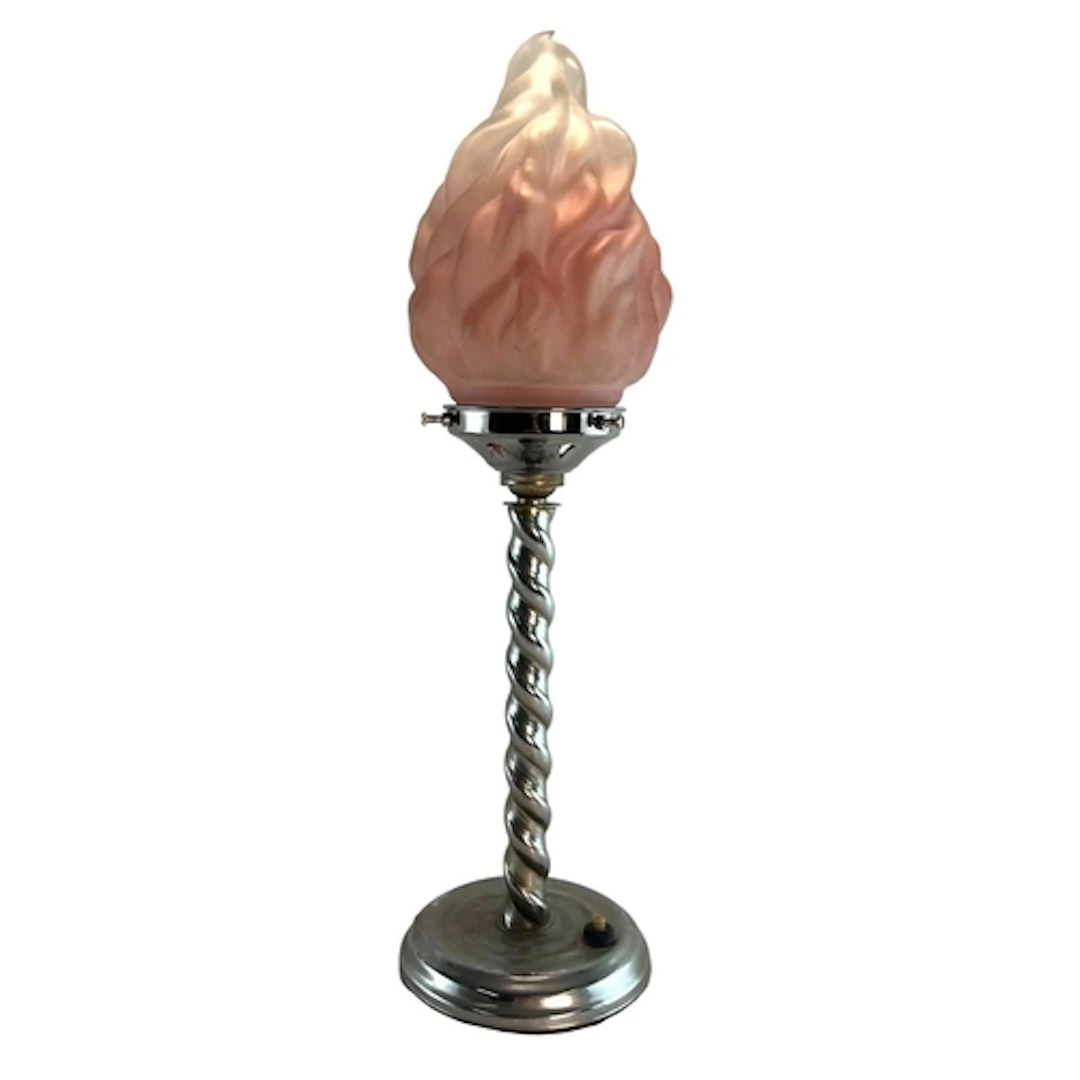 An Art Deco chrome and pink glass desk lamp. The pink glass ...