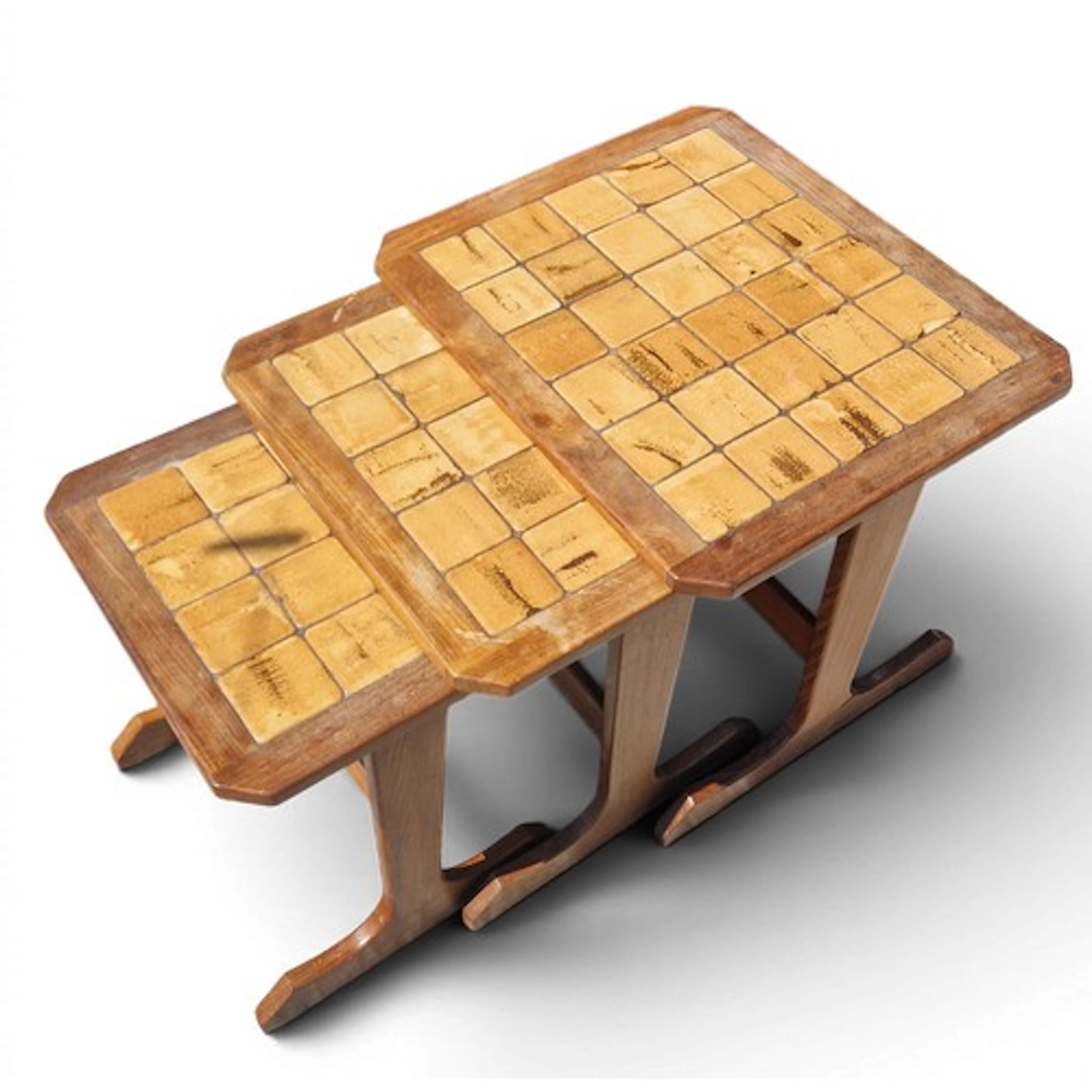 Nest of three tile-top occasional tables, each with solid wo...