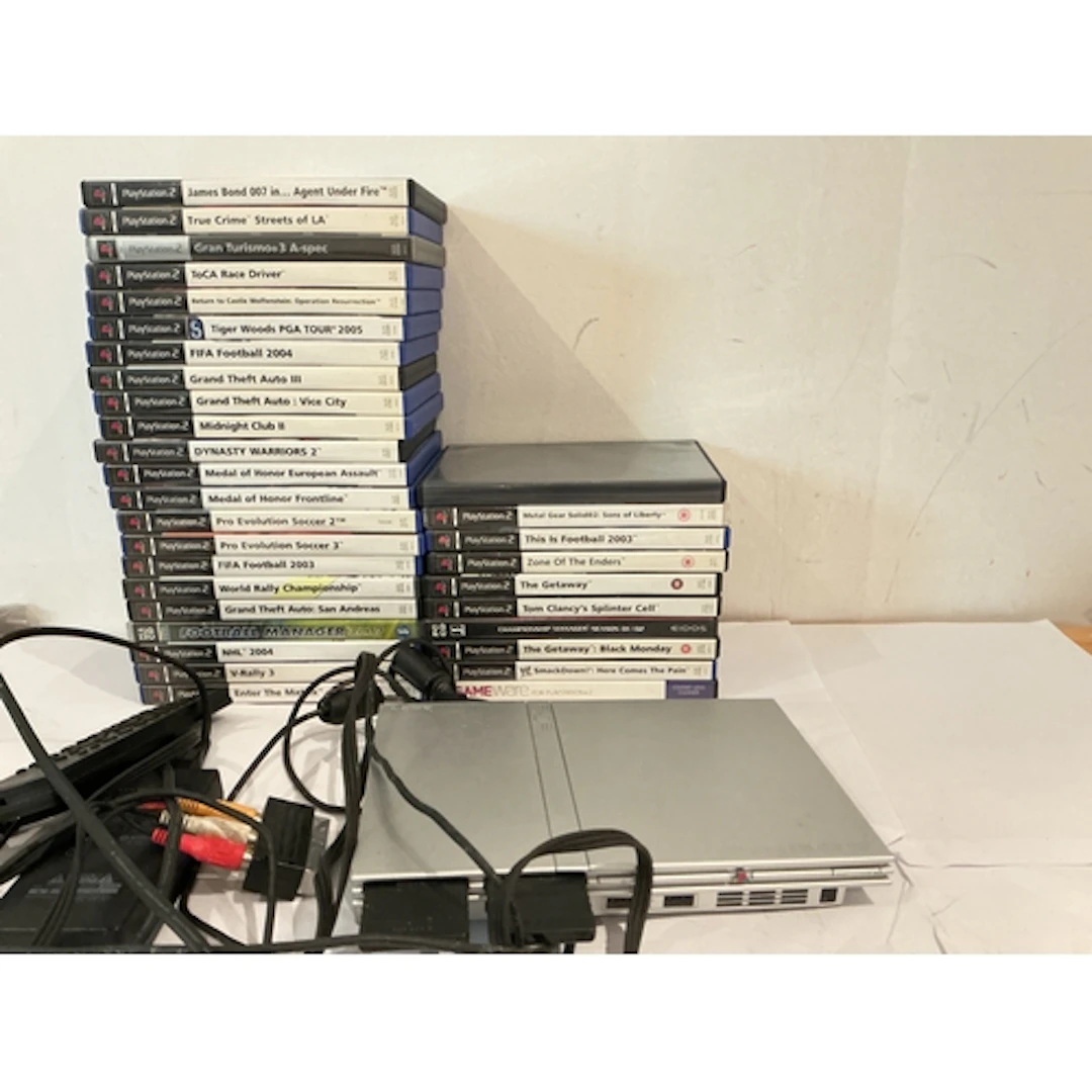 A PlayStation 2 Slim With A Collection Of Games. No Reserve.