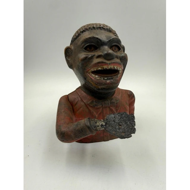 A cast iron turn of the century "jolly" mechanical money ban...