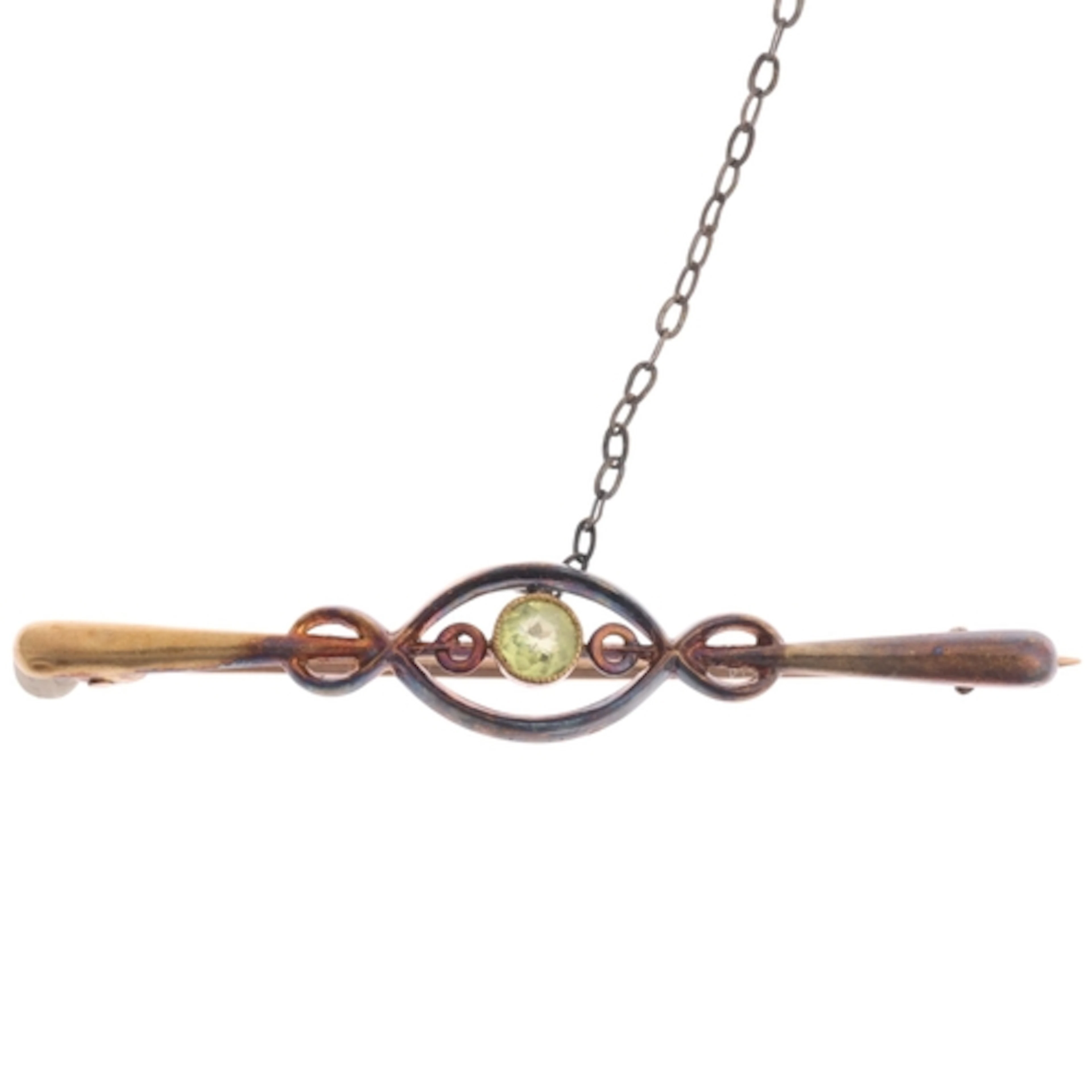 An Art Nouveau Edwardian 15ct gold peridot openwork bar broo...