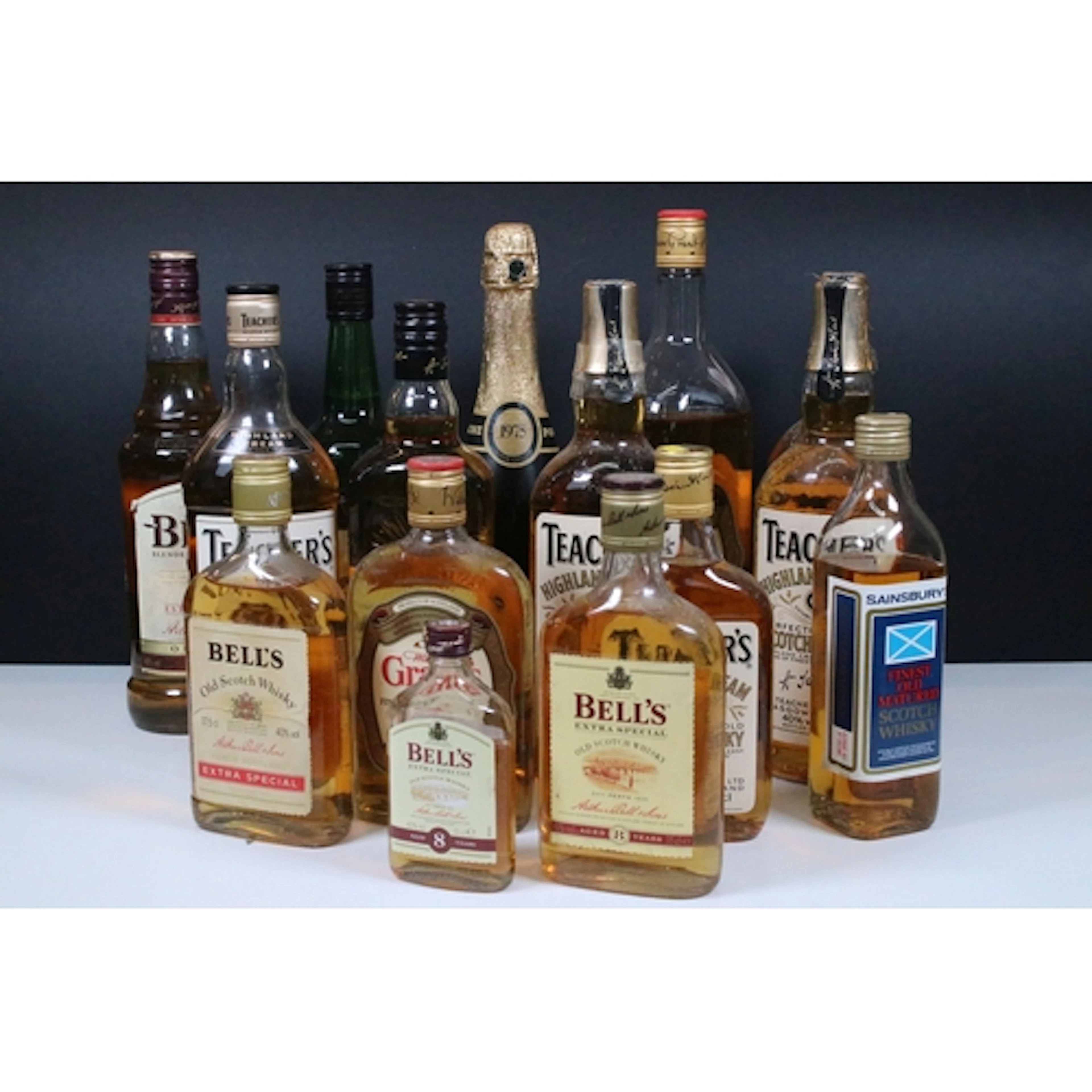 Collection of thirteen bottles of whiskey, to comprise Teach...