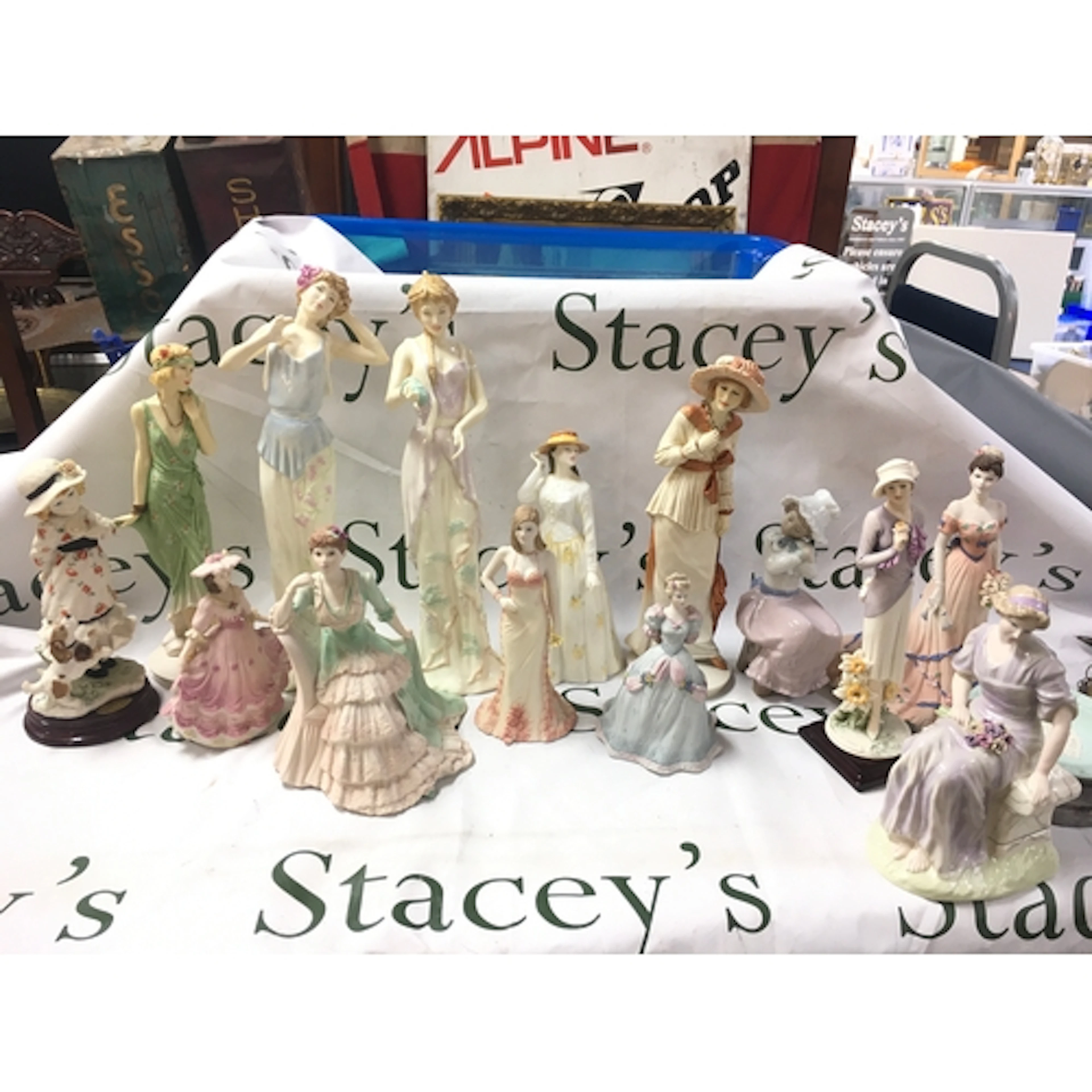A collection of various figures including Wedgwood, Coalport...
