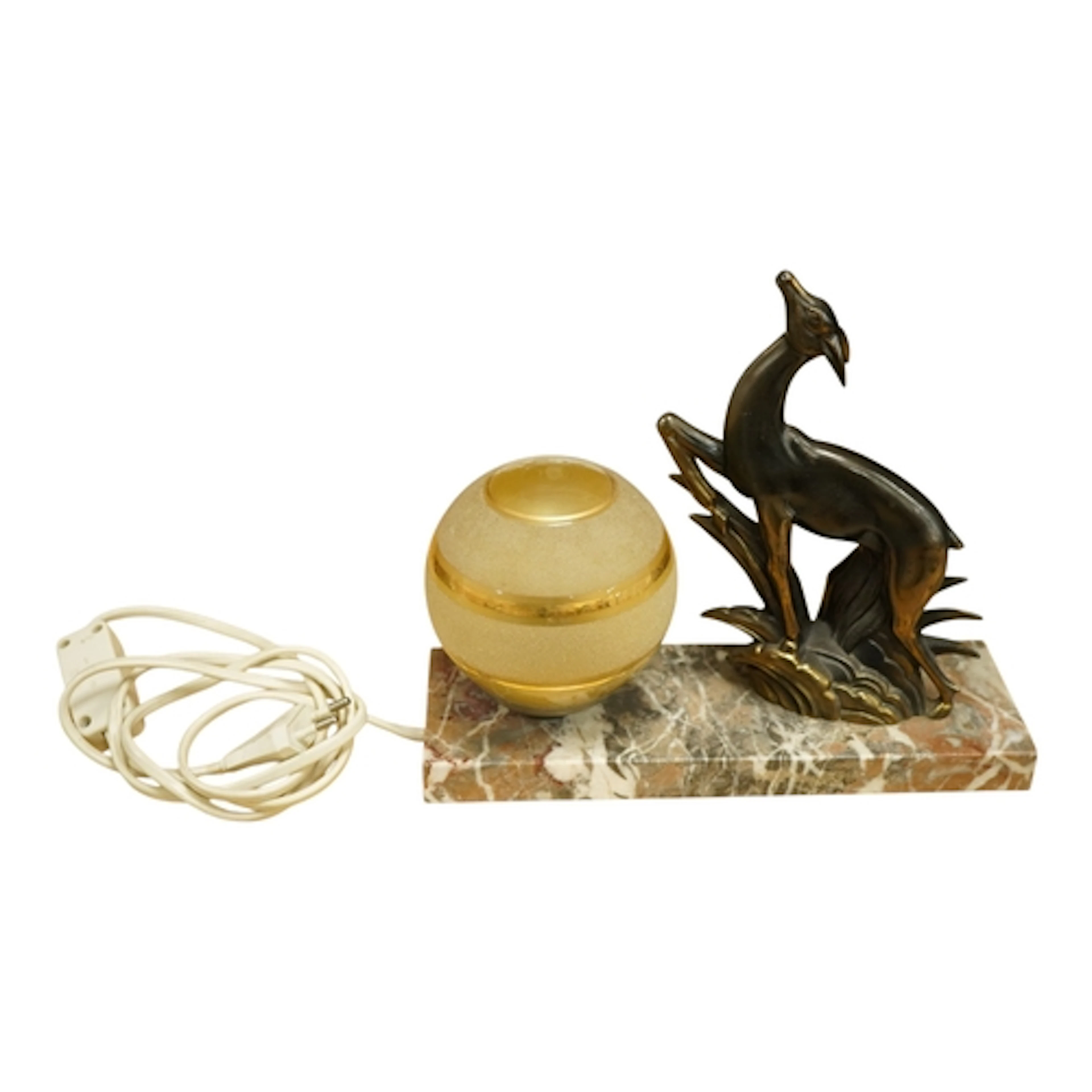 An Art Deco spelter table lamp surmounted with a leaping dee...