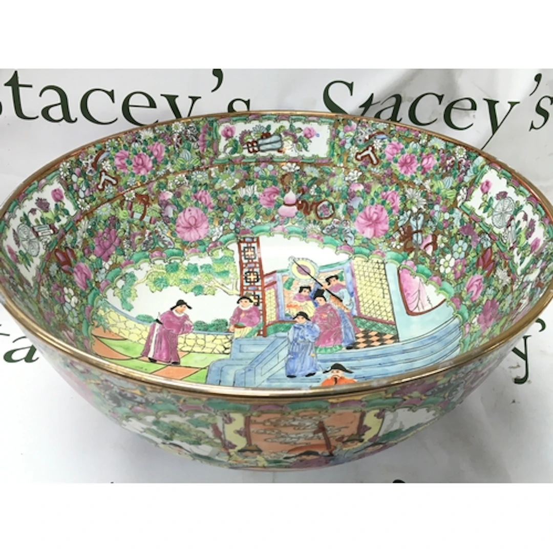 A Chinese Famille Rose bowl with a red six character mark at...