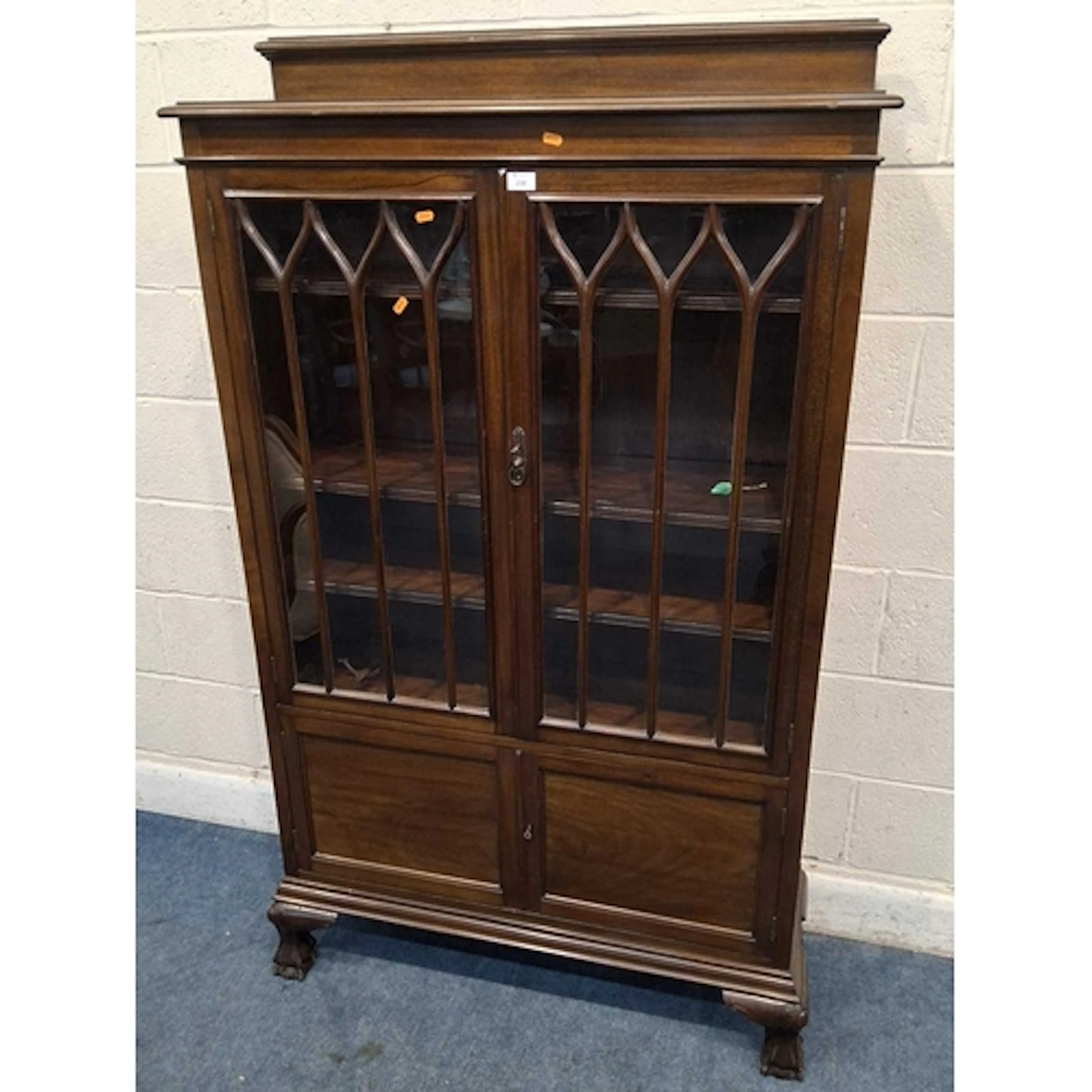 A 20TH CENTURY MAHOGANY BOOKCASE, the double glass doors enc...