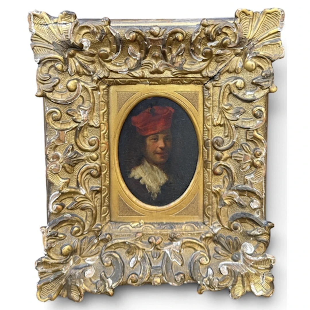 AN 18TH CENTURY PORTRAIT OF A MAN WEARING A RED CAP Oil on p...