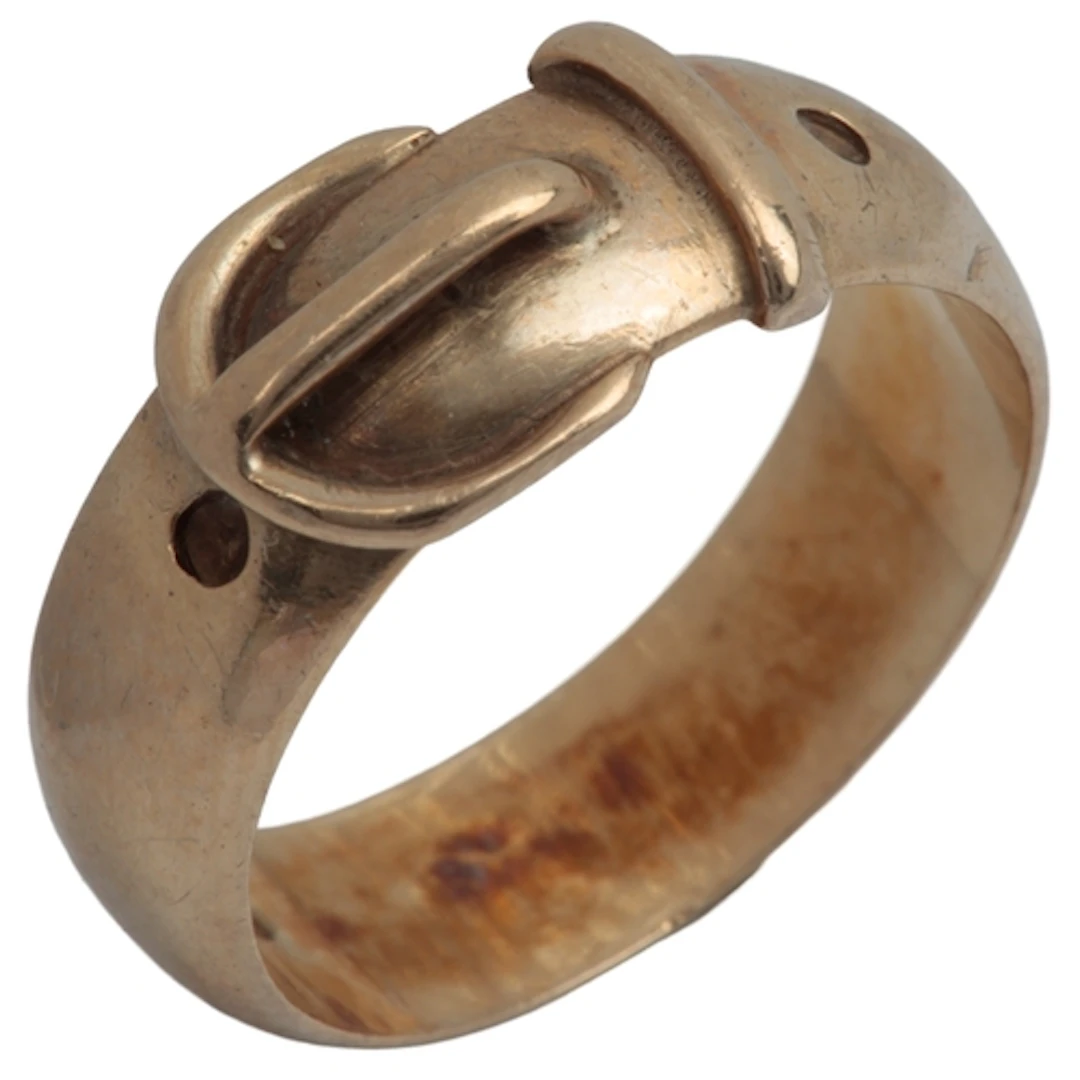 A gold ring, of buckle design, circa 1967, in 9ct gold, size...