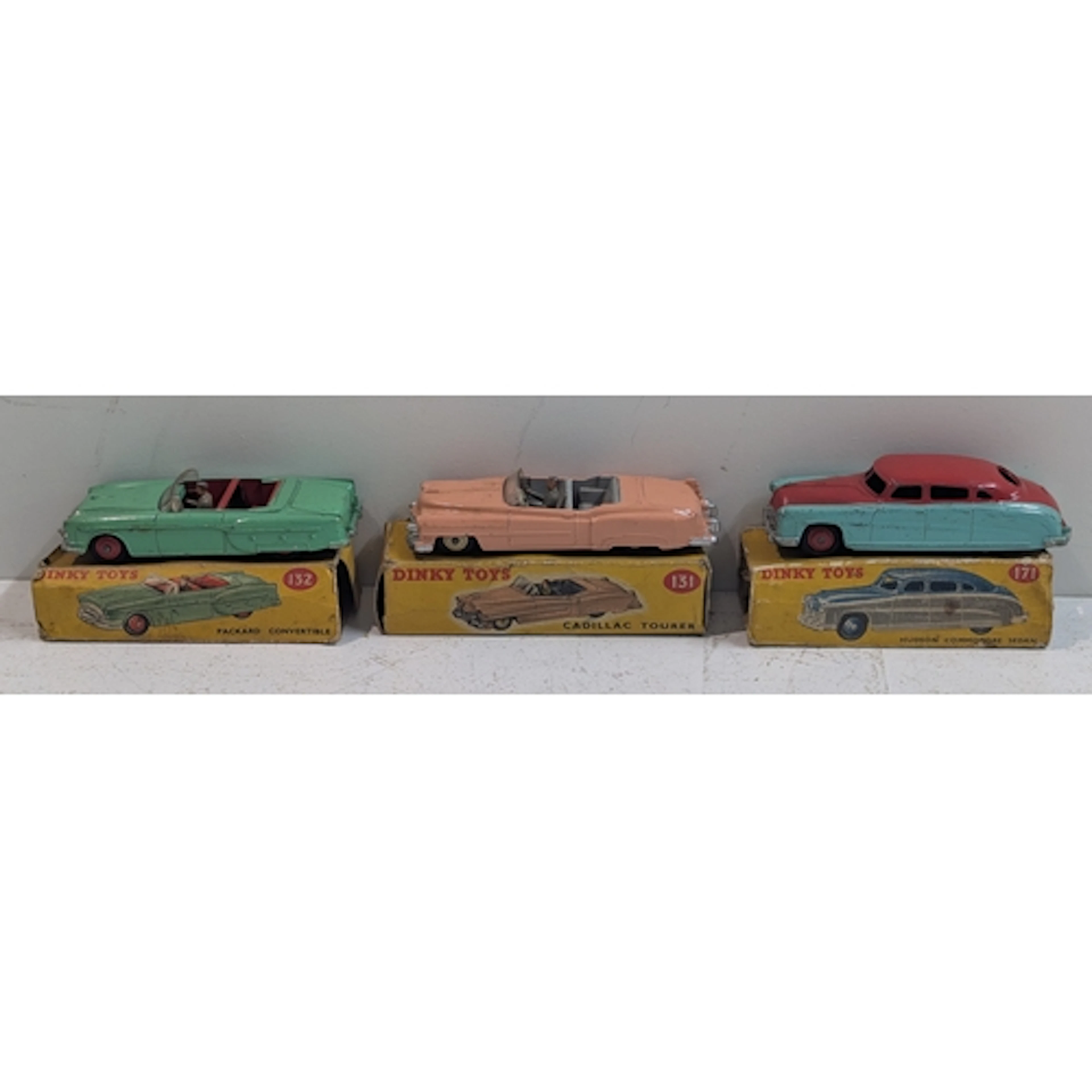 Three boxed Dinky Toys to include a Packard convertible 132,...