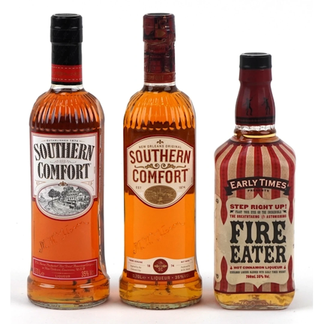 Three bottles of liqueurs including Southern Comfort and Ear...