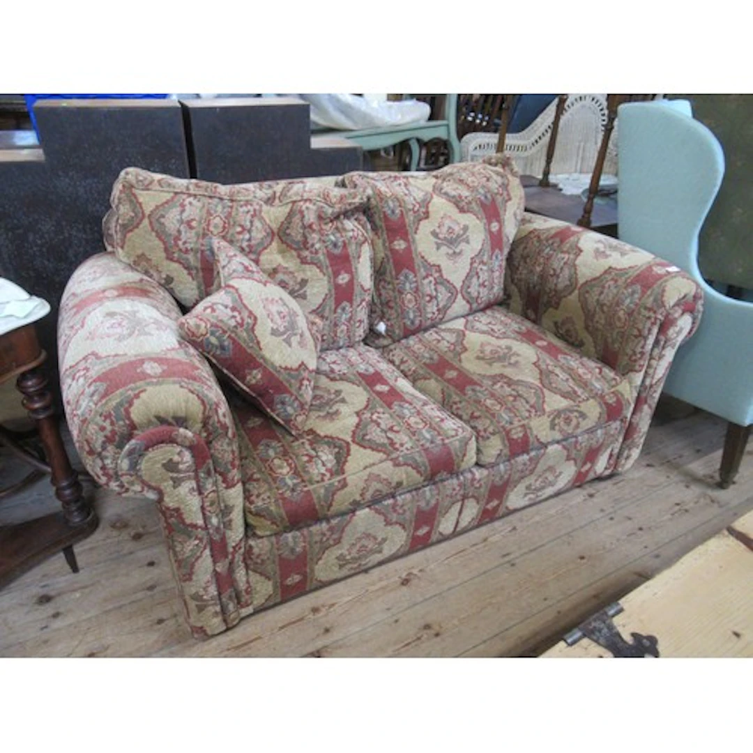A modern two seat sofa, with labels