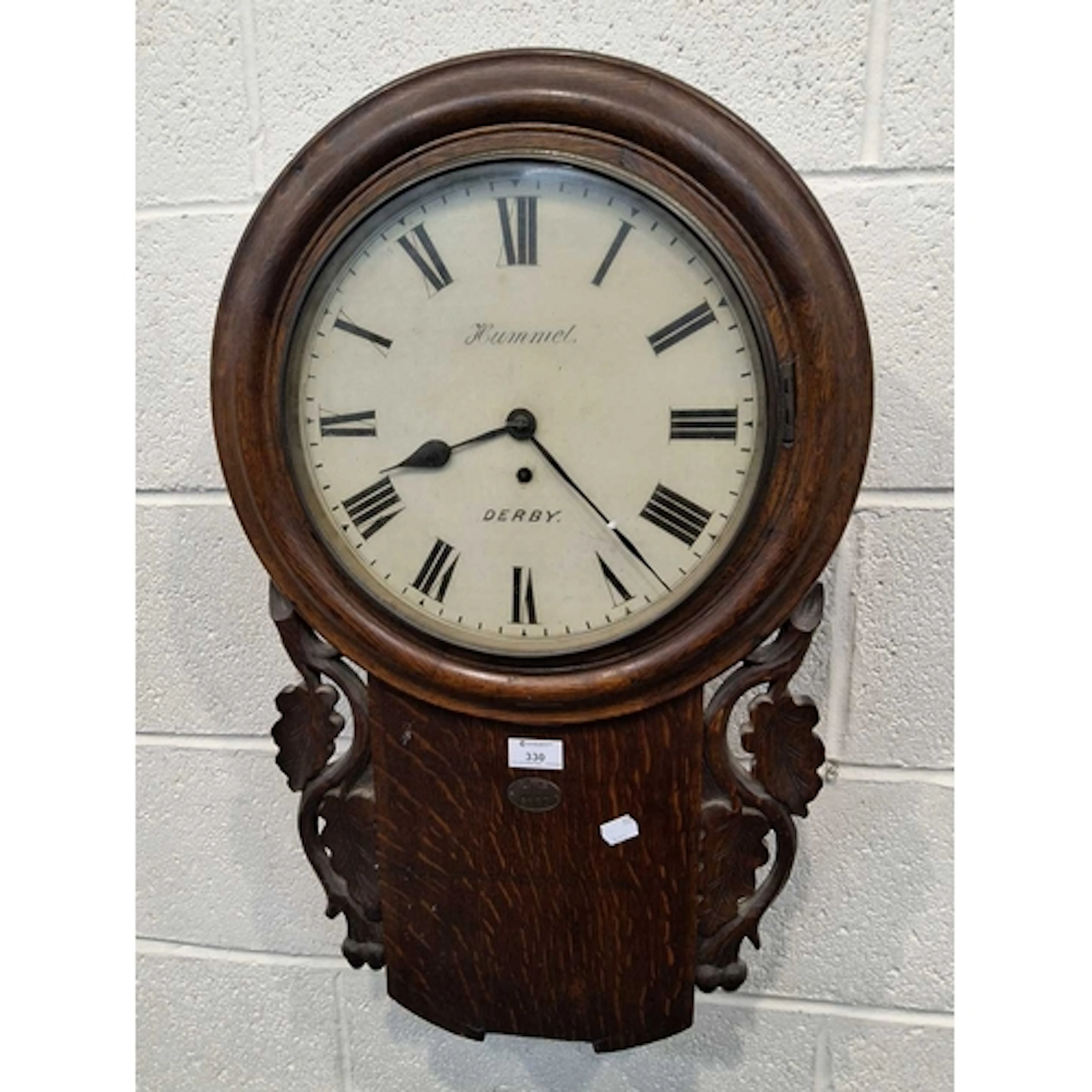 AN EARLY 20TH CENTURY OAK CASED DROP DIAL WALL CLOCK, the gl...