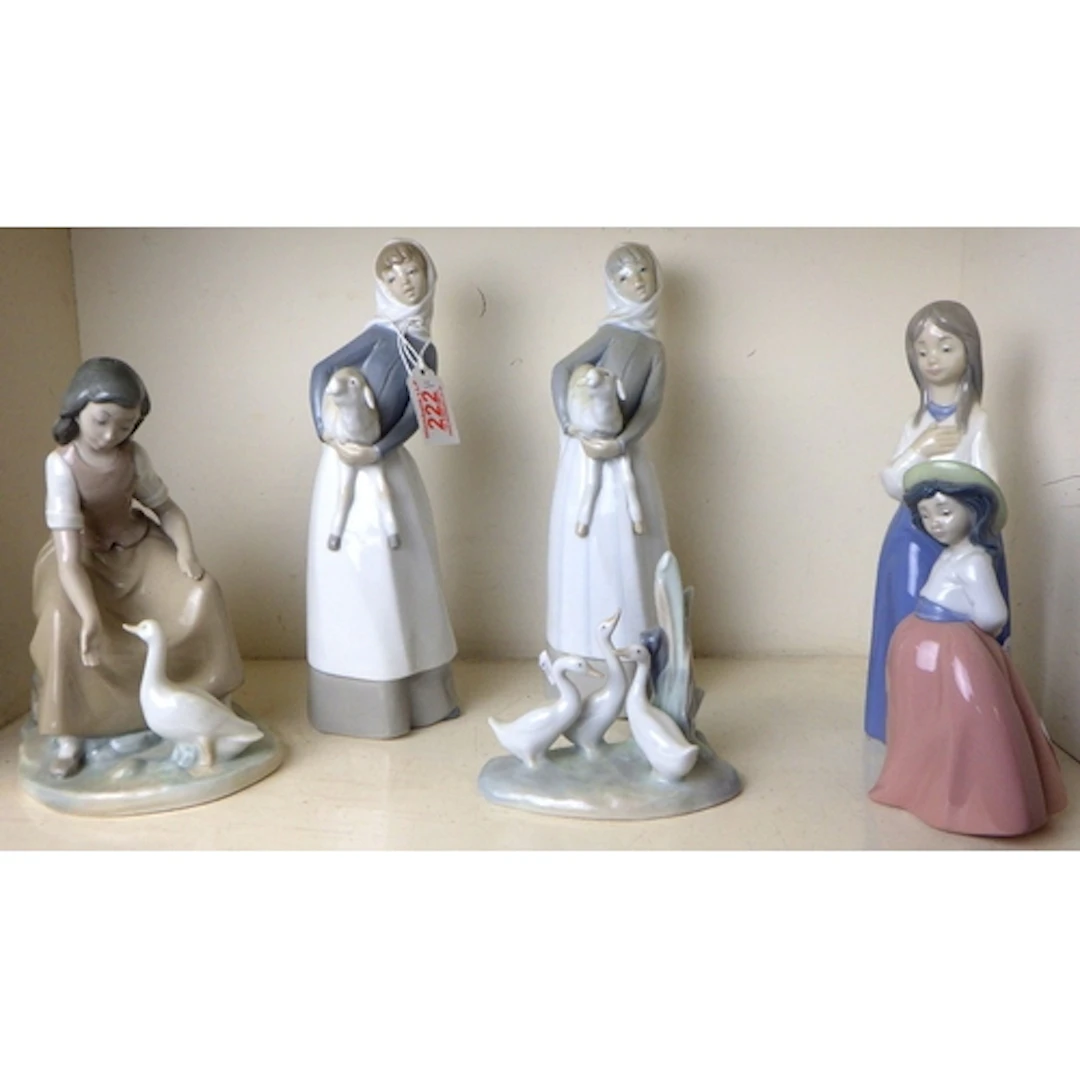 Two Lladro figures of a woman & lamb together with four NAO ...