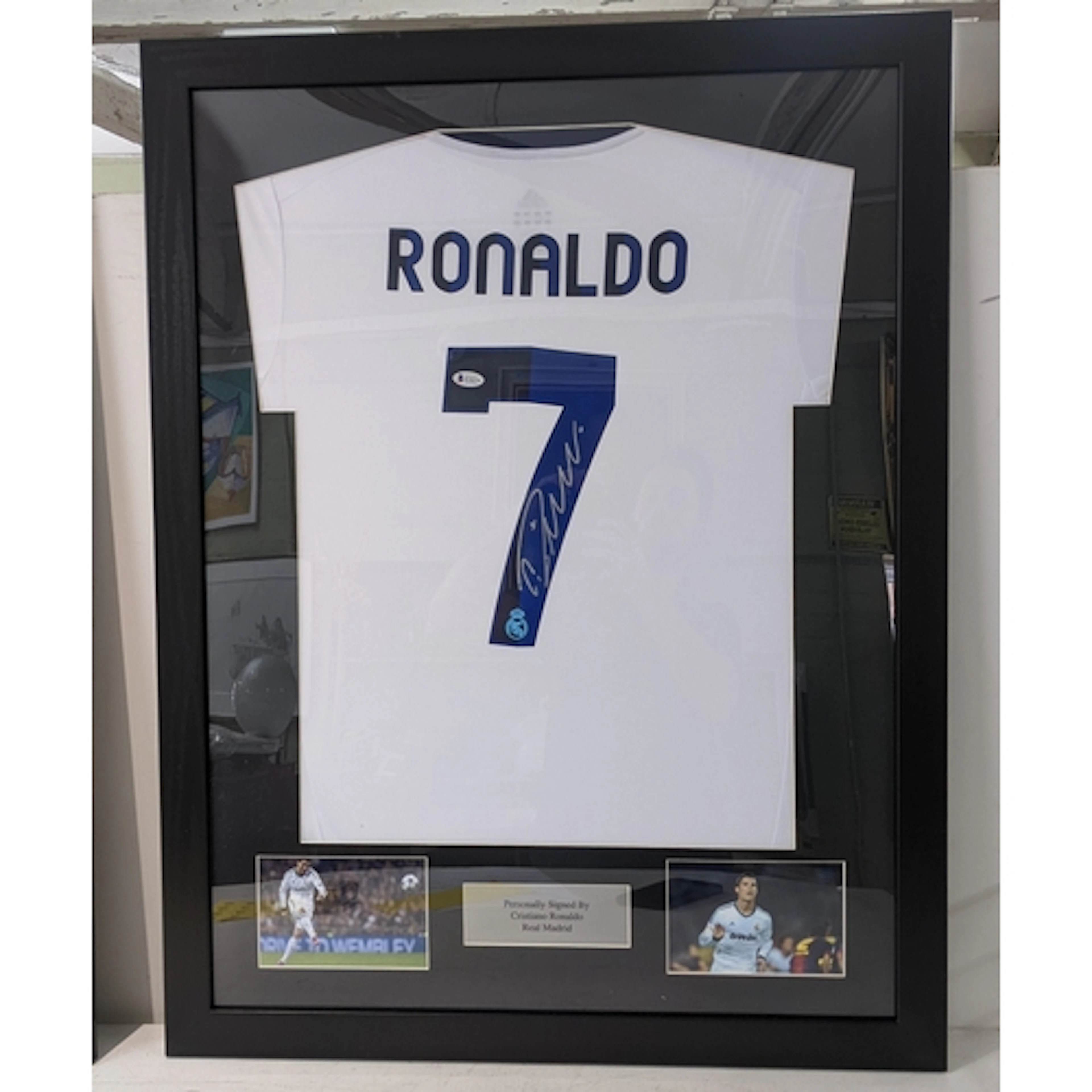 A Real Madrid framed football shirt signed by Cristiano Rona...