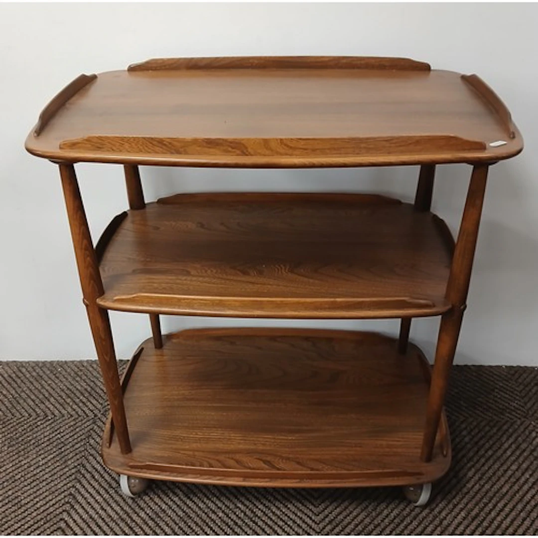 Ercol light oak three-tier trolley.
