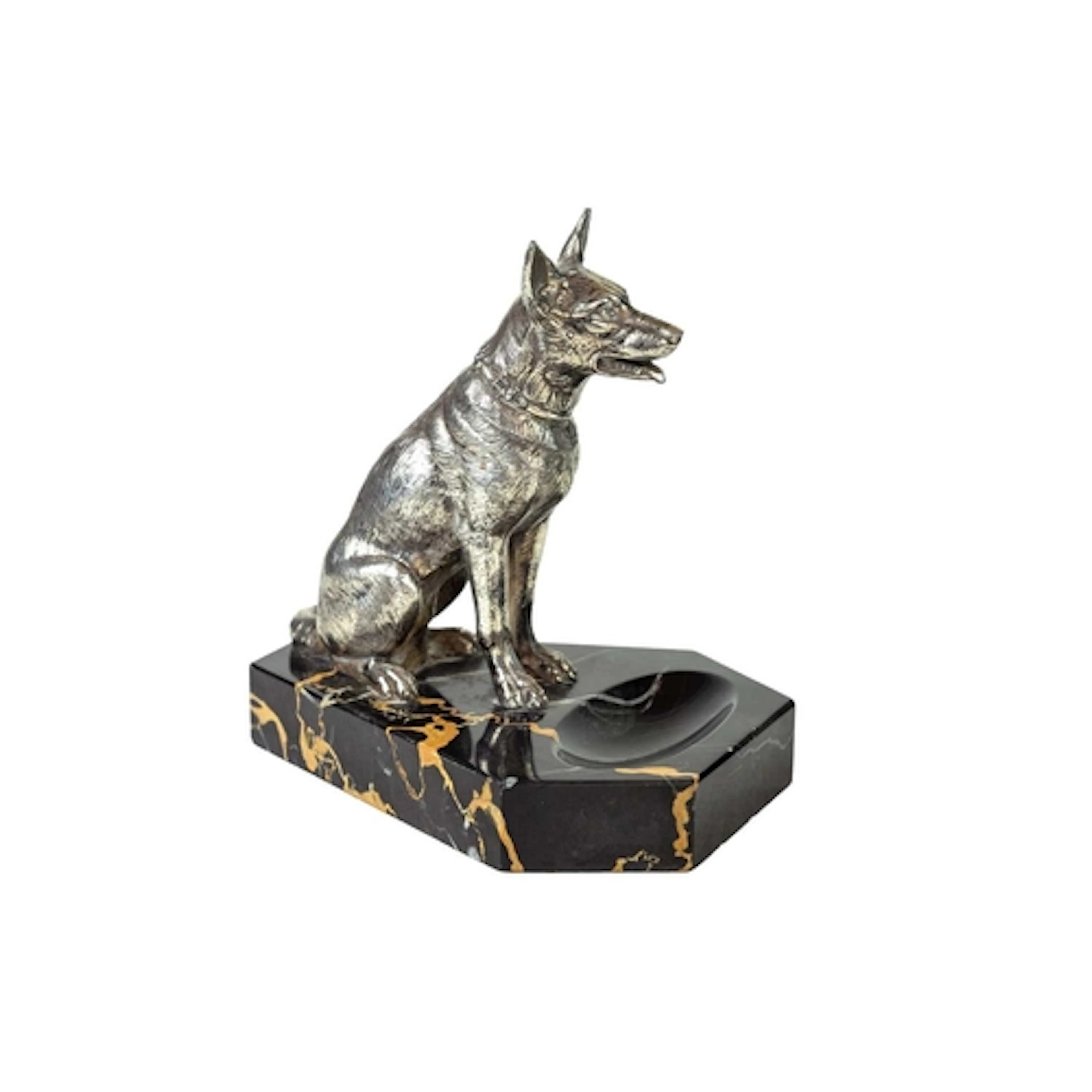 A French silver plated model of a seated German Shepherd dog...