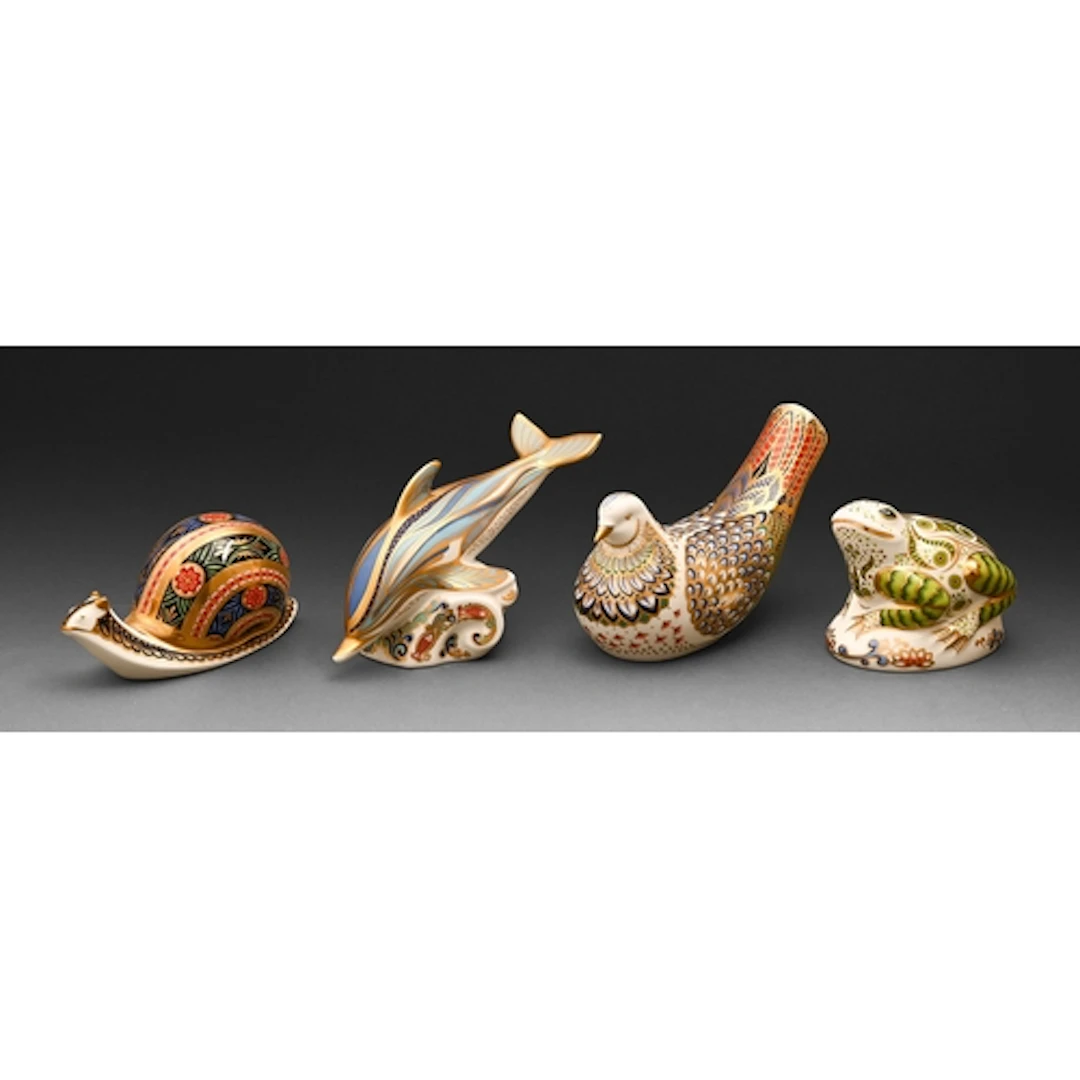Four Royal Crown Derby paperweights, to include Millennium D...