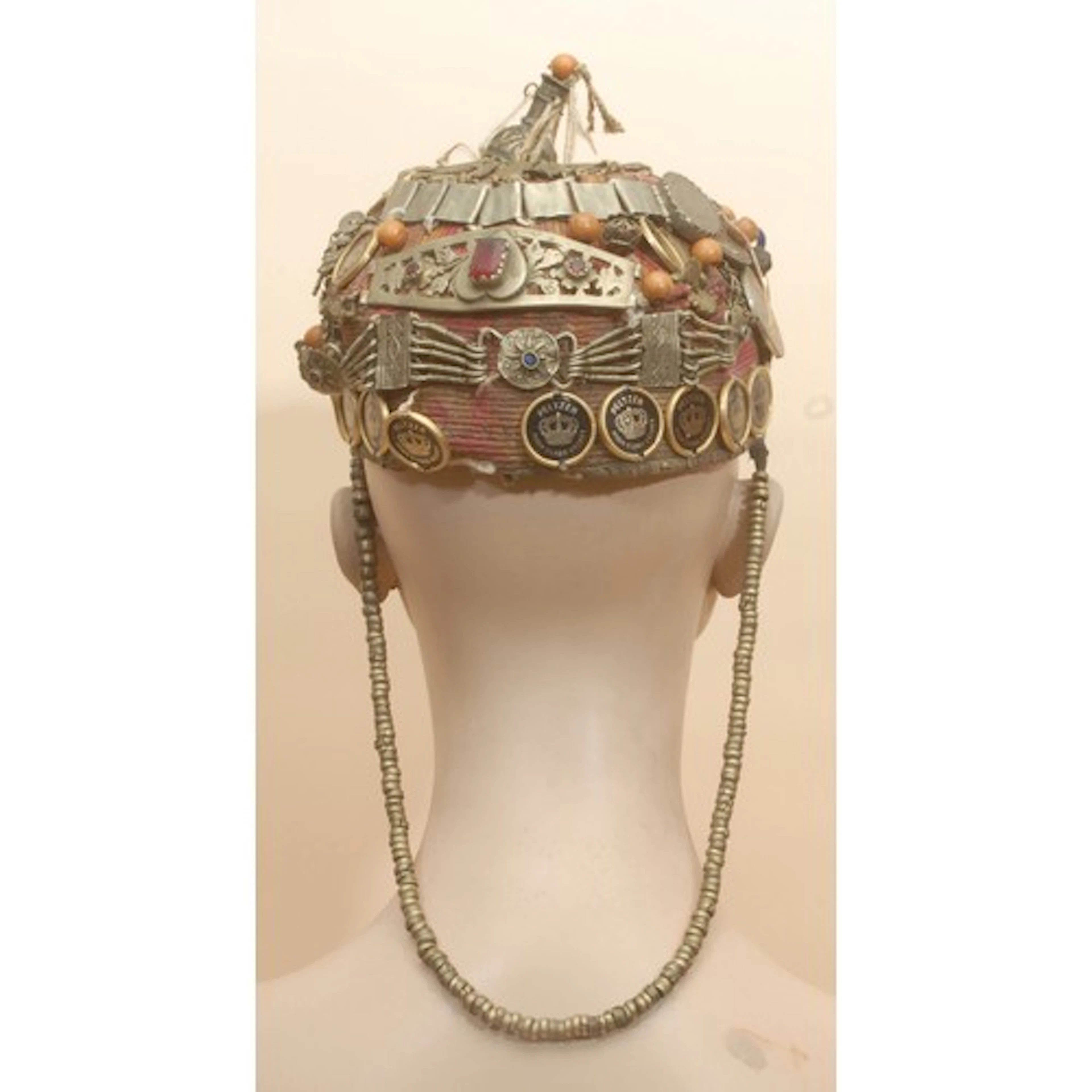 Tribal Art - an Afghan wool cap, worked in polychrome, embel...