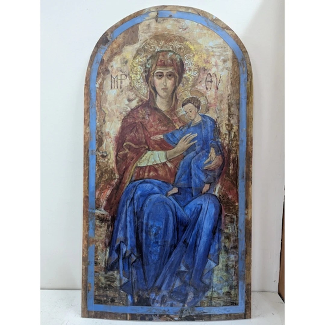 A religious painting on wooden plaque depicting mother and c...