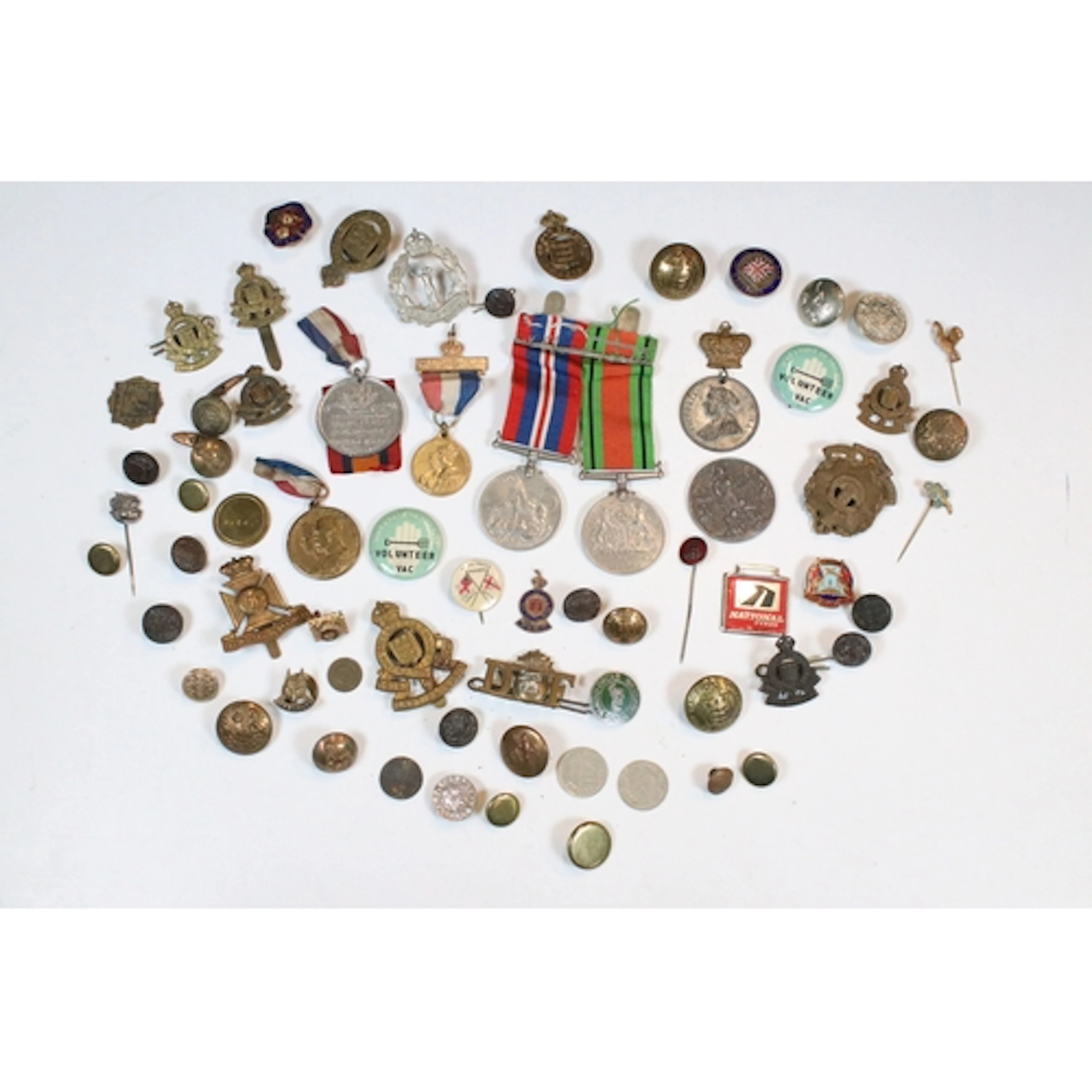 Collection of pins and medals to include 'The Defence Medal'...