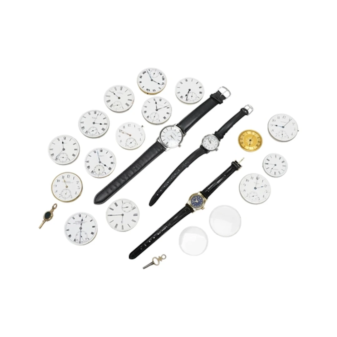 A collection of assorted pocket watch movements including Ta...