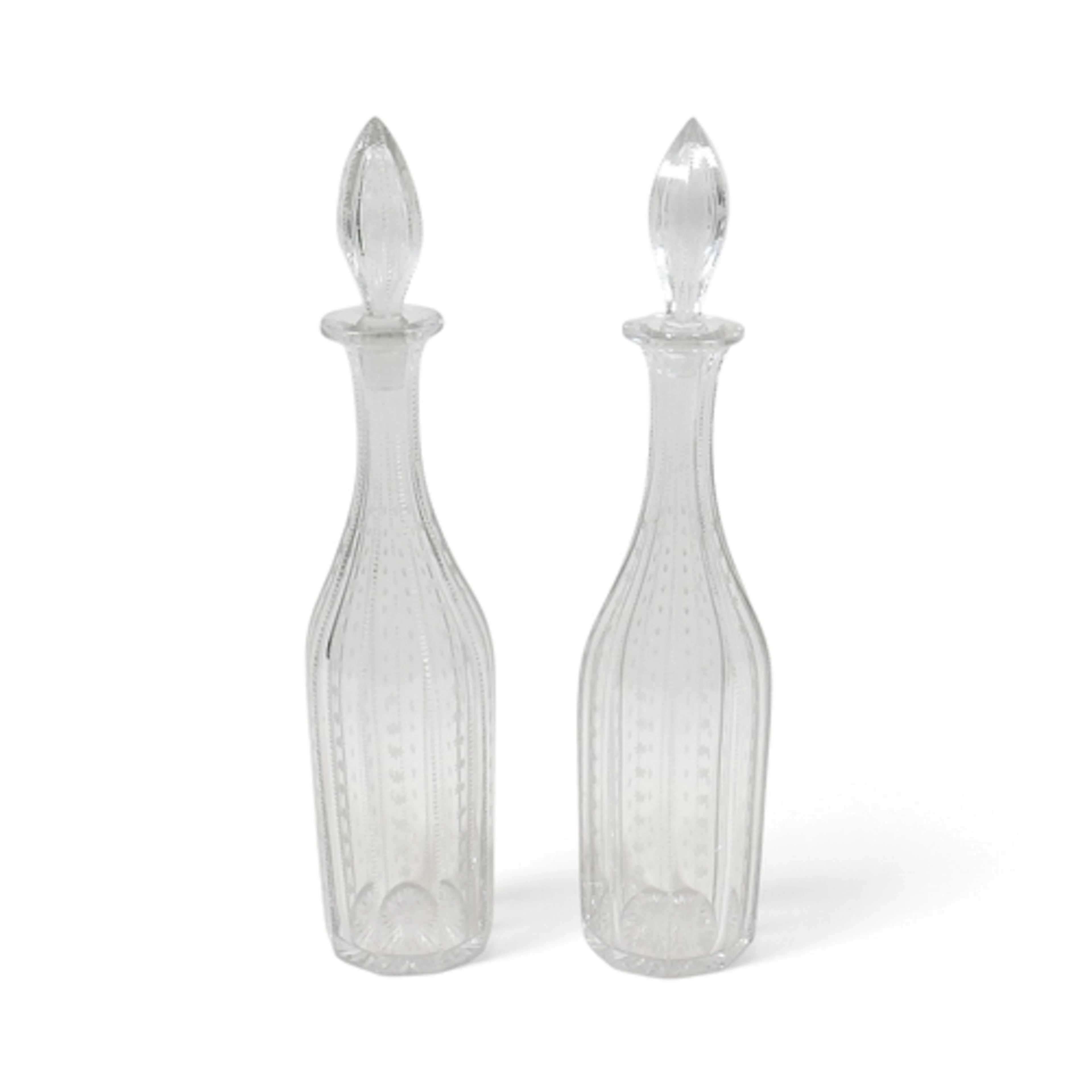A PAIR OF 19TH CENTURY CUT GLASS DECANTERS. with stoppers, e...