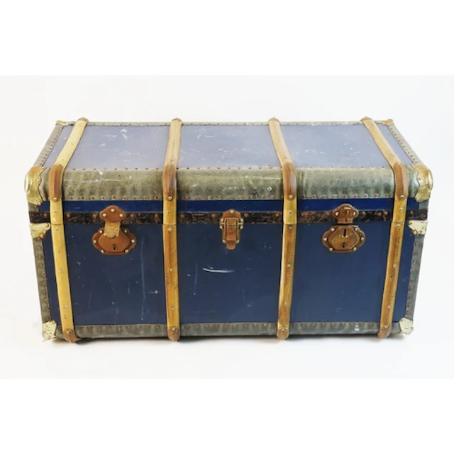 A large metal and wooden bound travelling trunk with carryin...