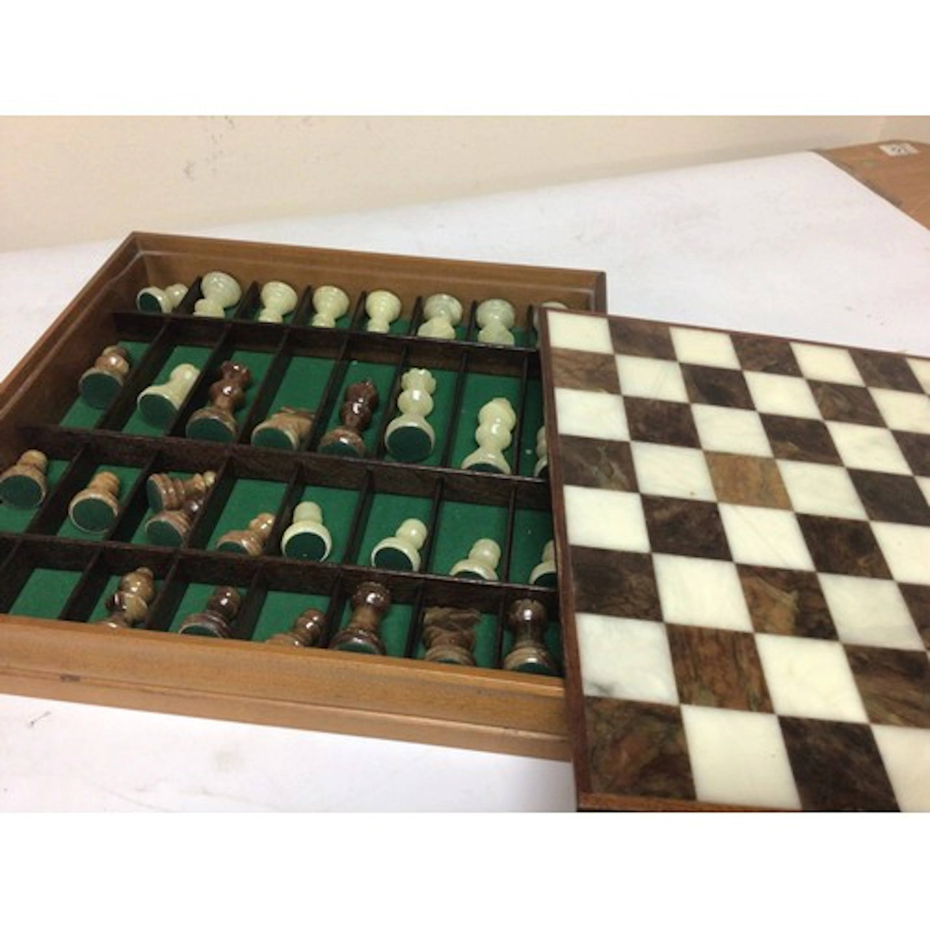 An onyx chess set with matching Onyx pieces.