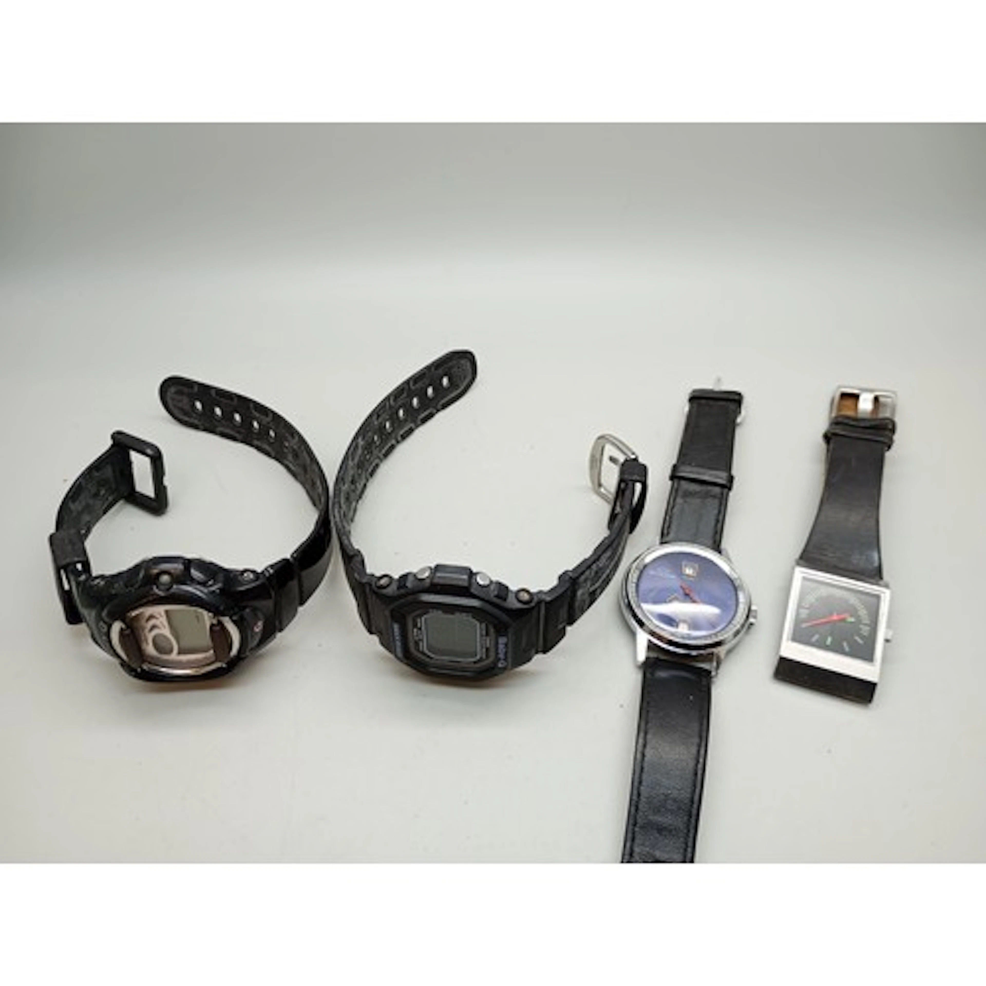 A Buler wristwatch, two Casio Baby G examples and a Diesel w...