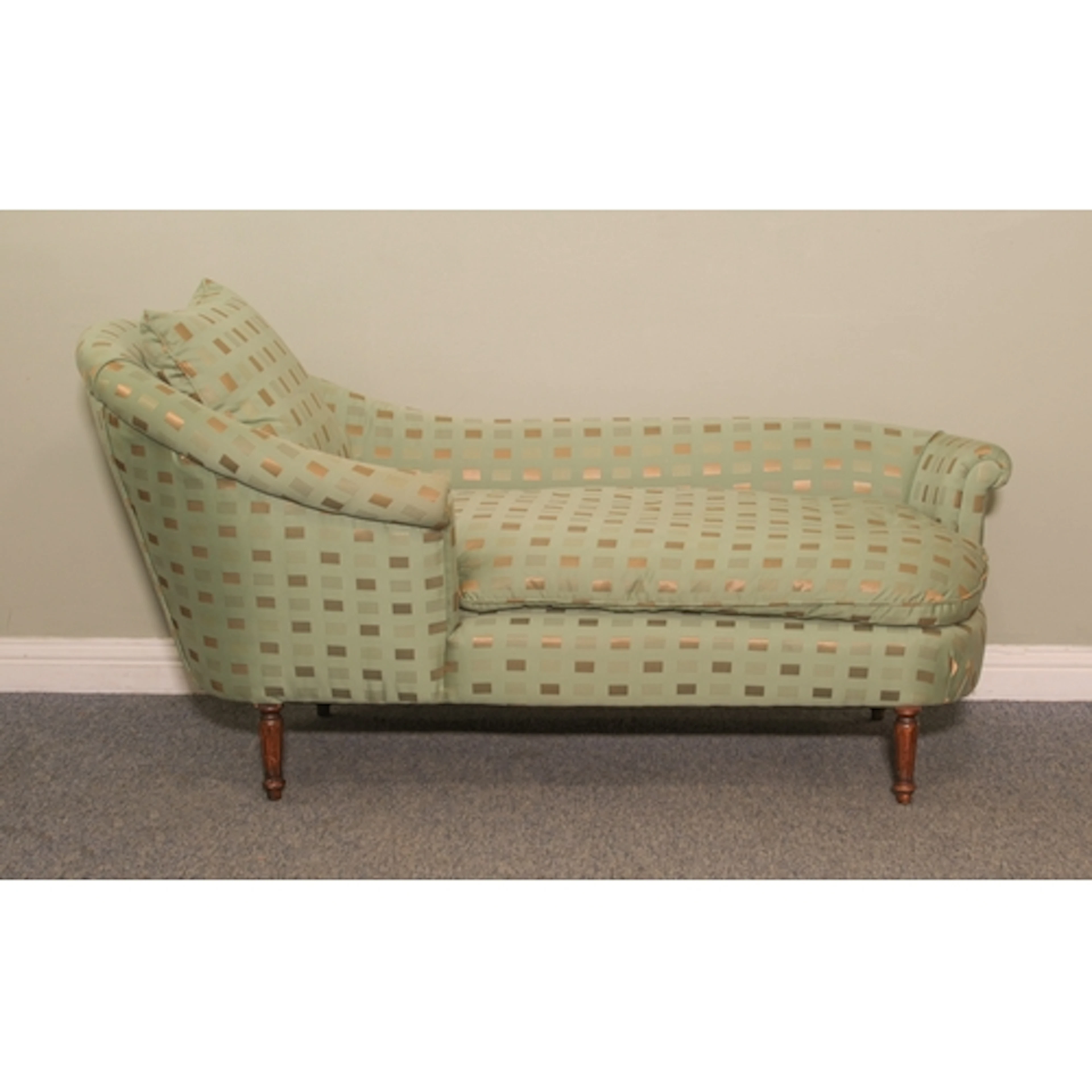 A modern chaise longue or day bed - upholstered in green and...