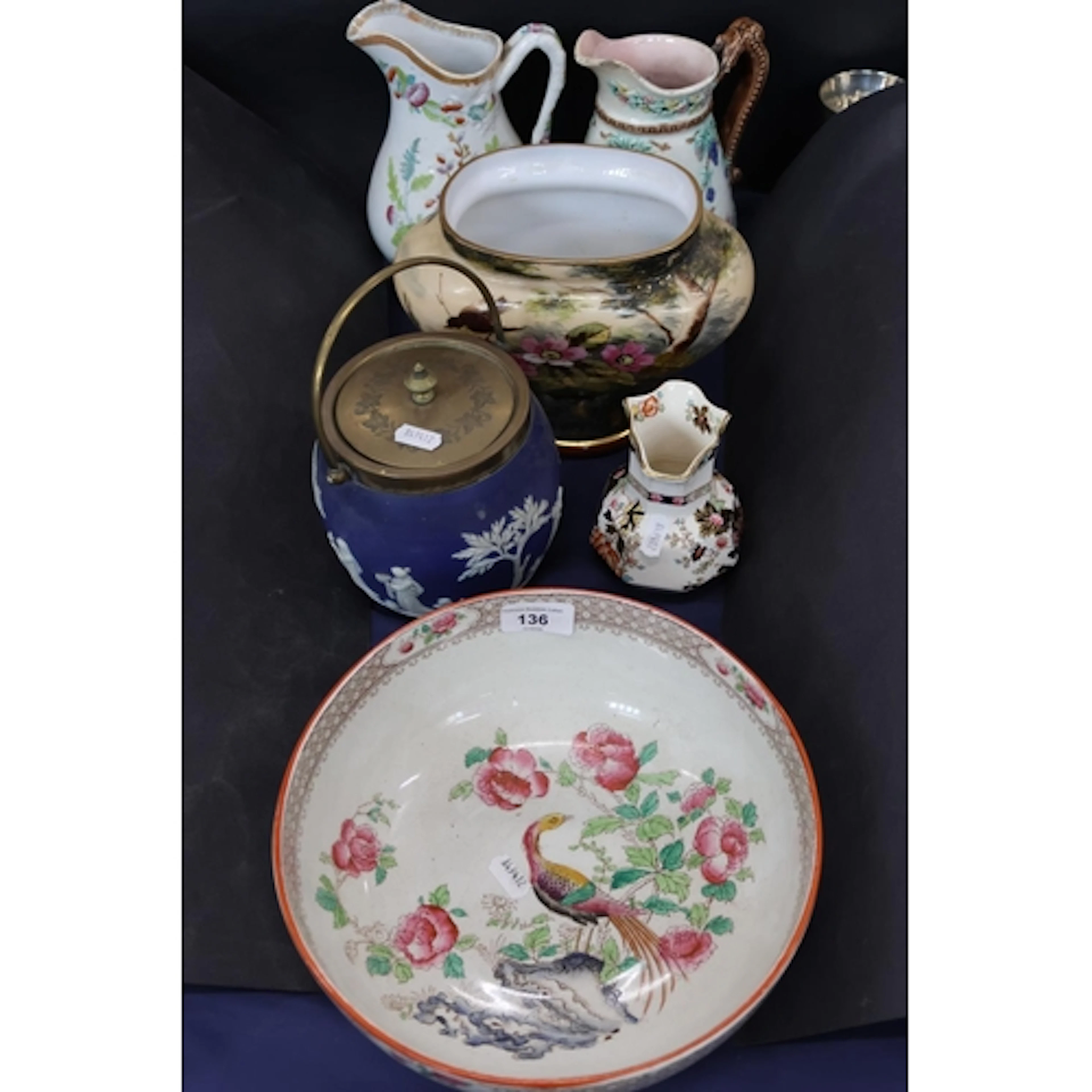 Ceramics including a rose bowl, a biscuit jar, water jugs an...