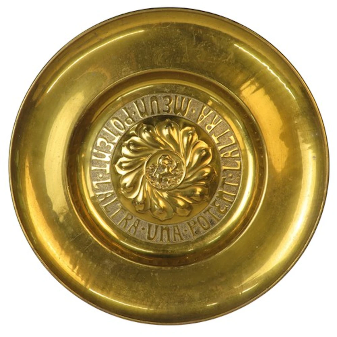 A BRASS 17th CENTURY TYPE ALMS DISH the central motif of a r...