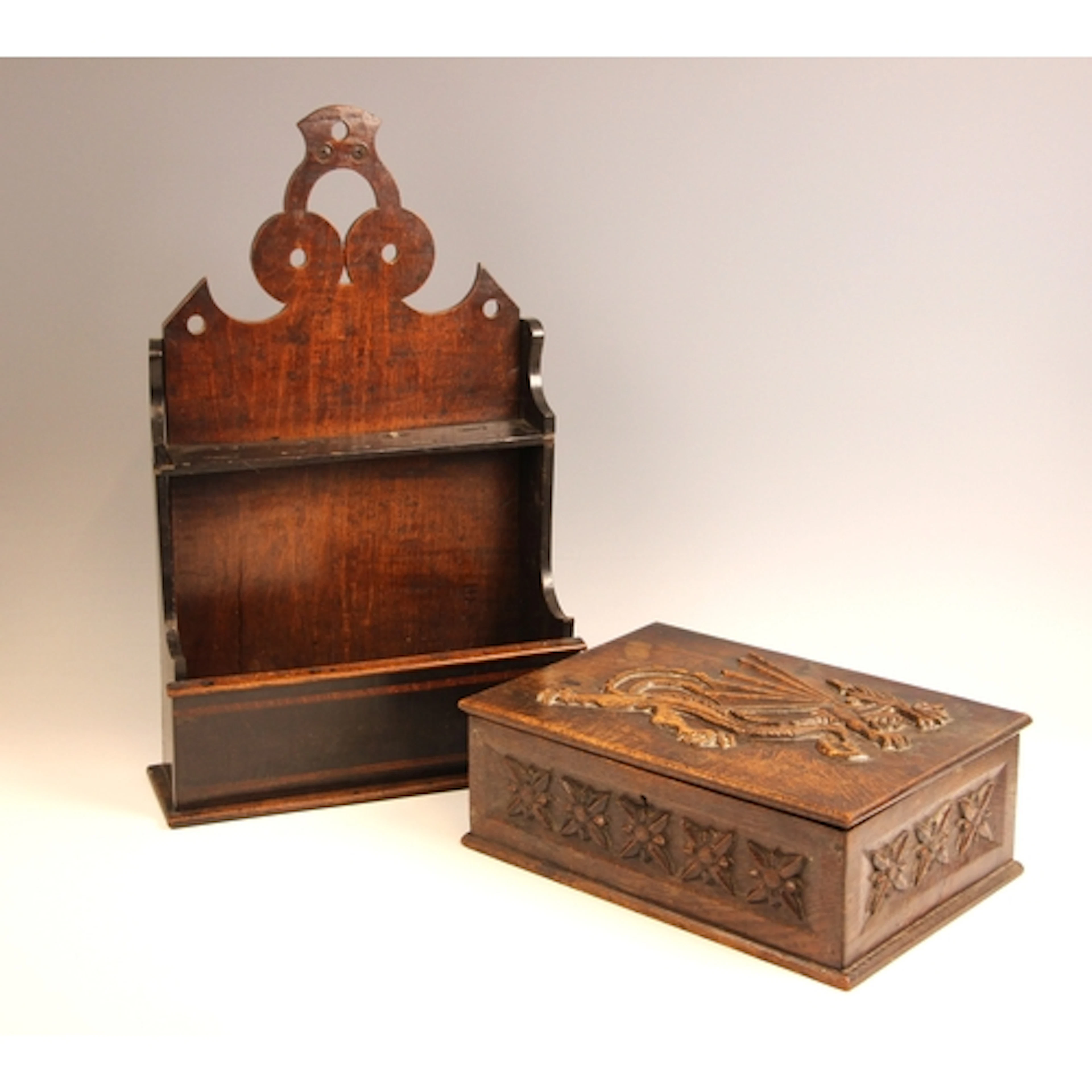 An 18th century oak spoon rack, the wall mounting pierced ba...