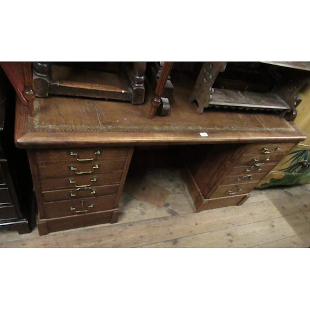 Mid 20th Century oak twin pedestal desk, the leather inset t...