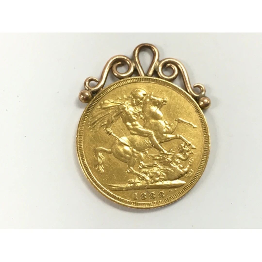 An 1888 Melbourne mint mark sovereign with mount. 8.5g