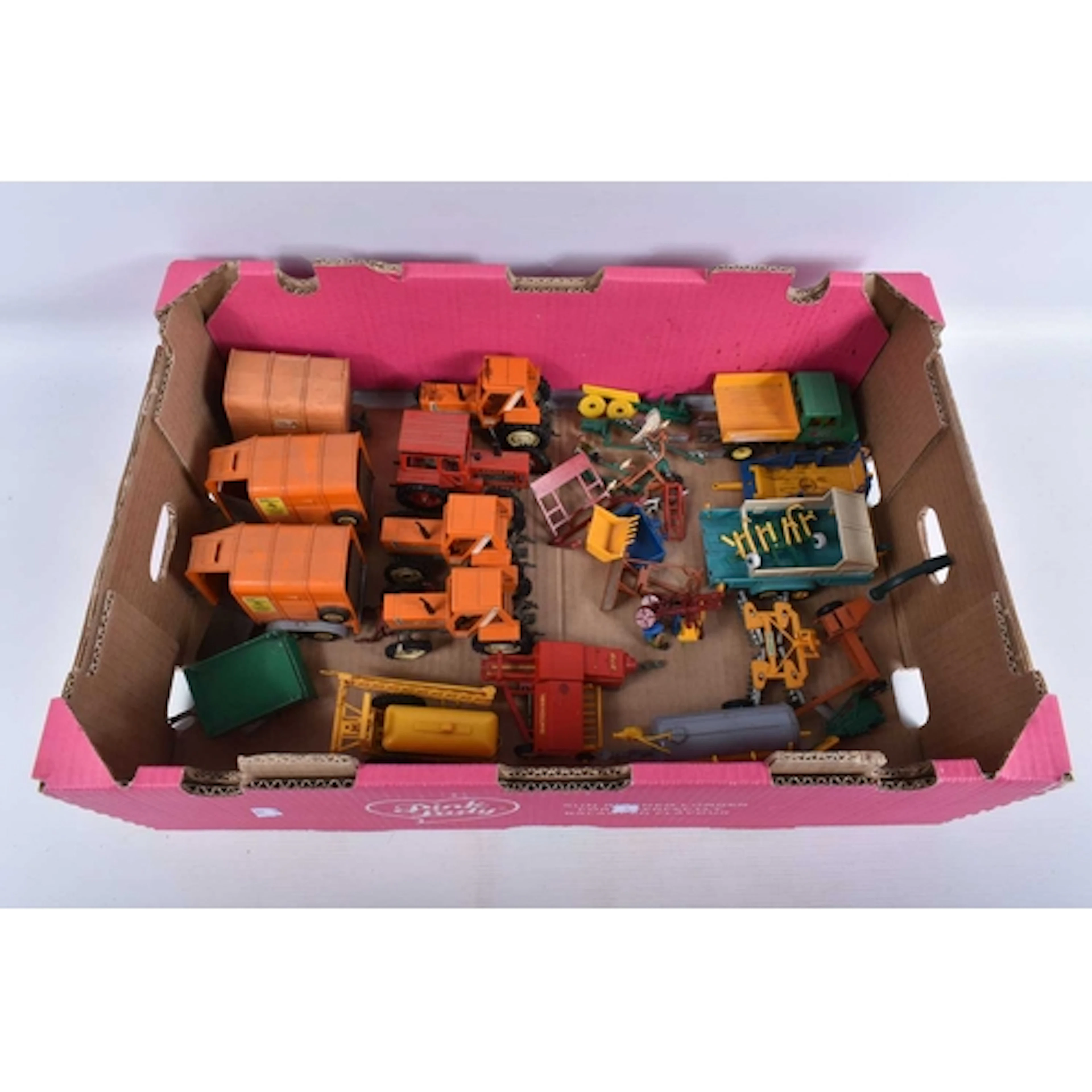 A QUANTITY OF UNBOXED BRITAINS TRACTORS AND FARMING IMPLEMEN...