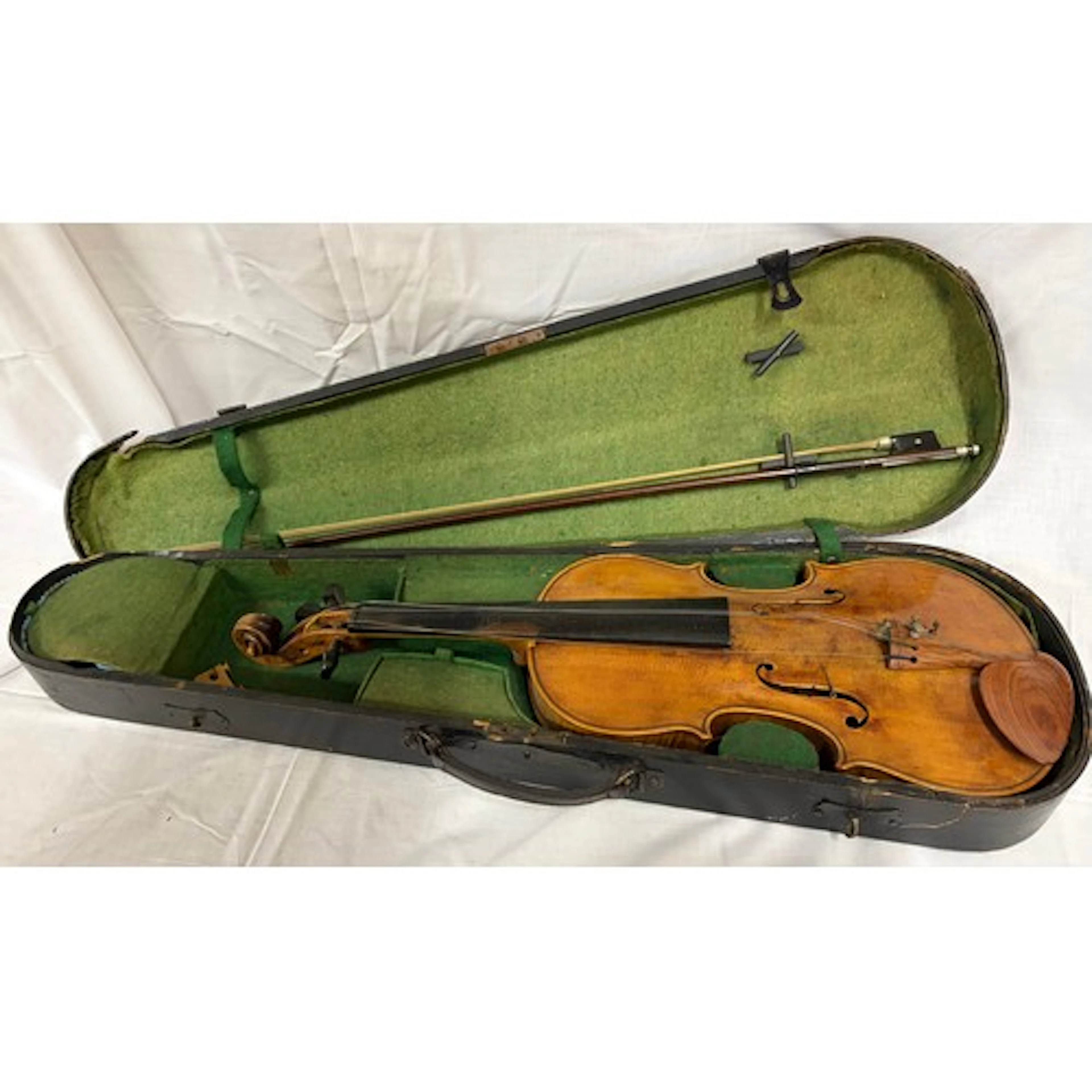 Violin with bow in black wooden case a/f, total length 60cm.