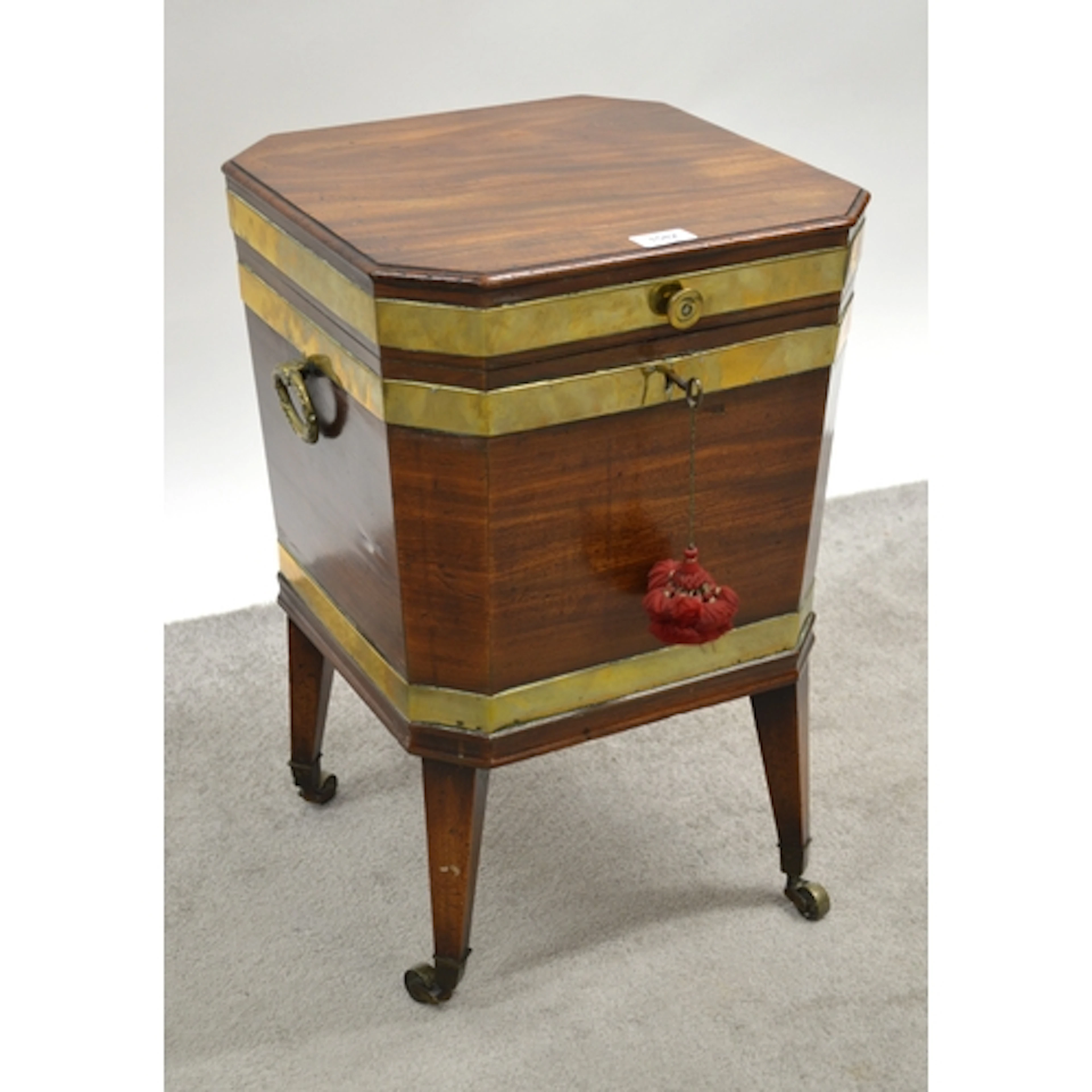 19th Century mahogany and brass bound wine cooler, of irregu...