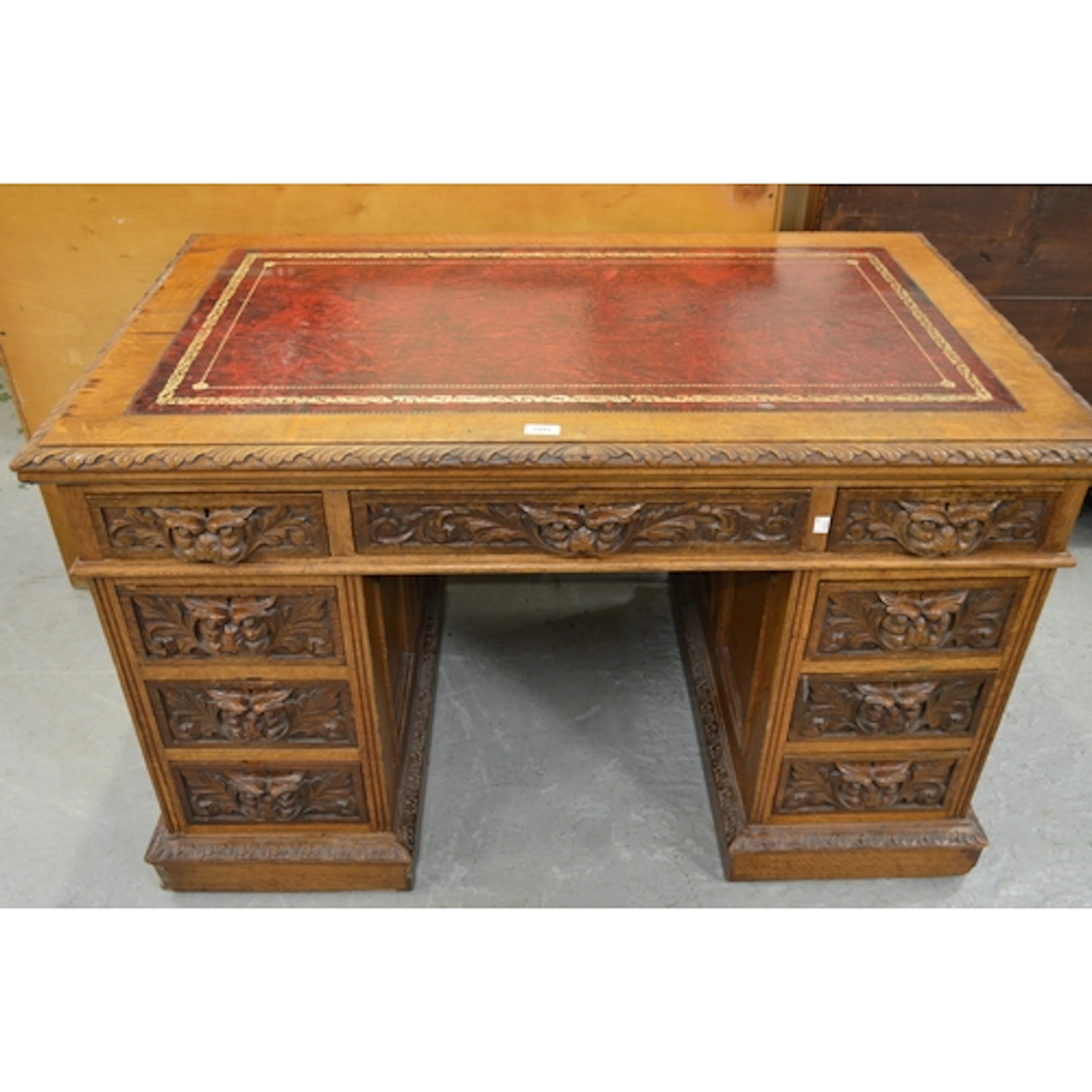 19th Century carved oak twin pedestal desk, the leather inse...