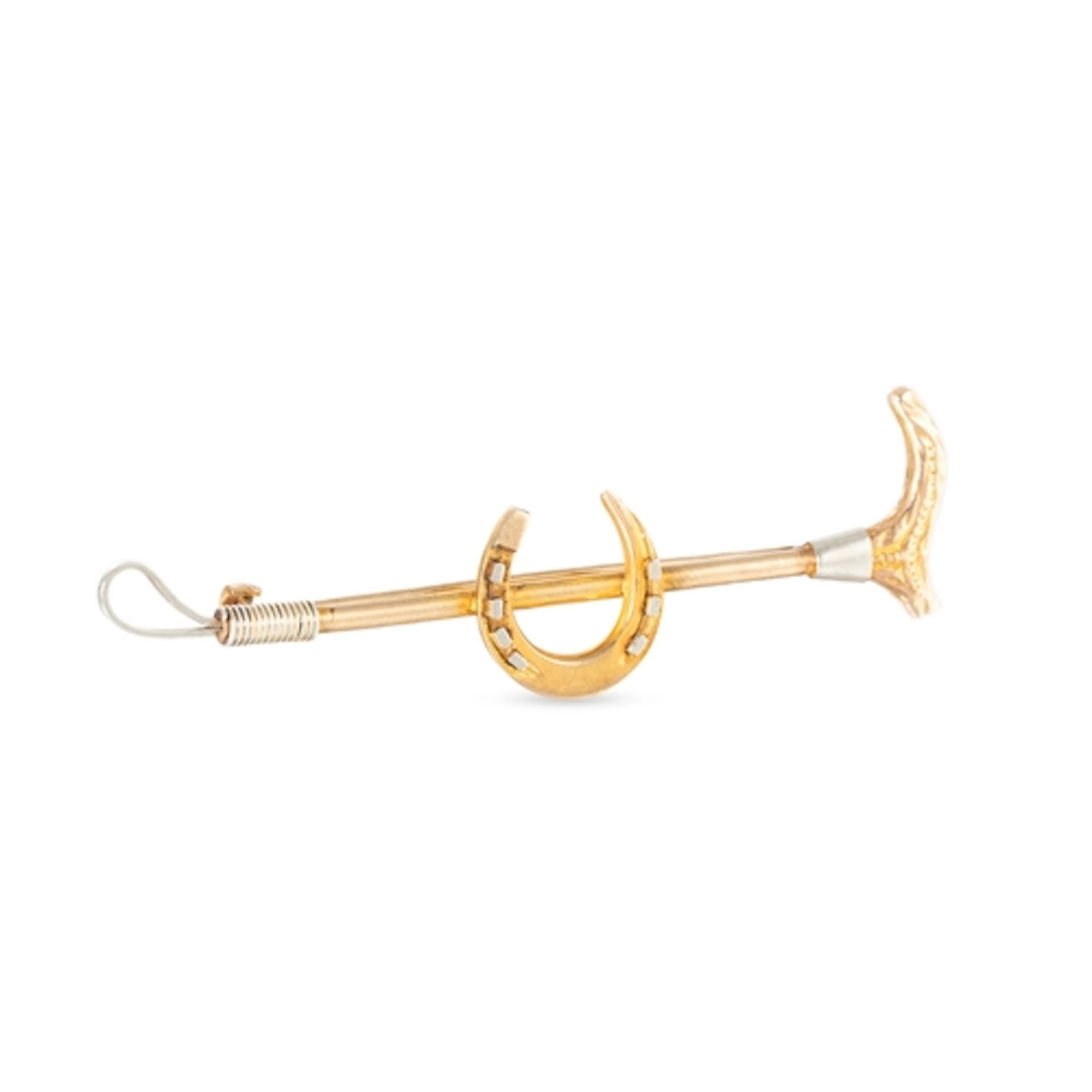 A VINTAGE EQUESTRIAN THEMED RIDING CROP AND HORSE-SHOE BROOC...