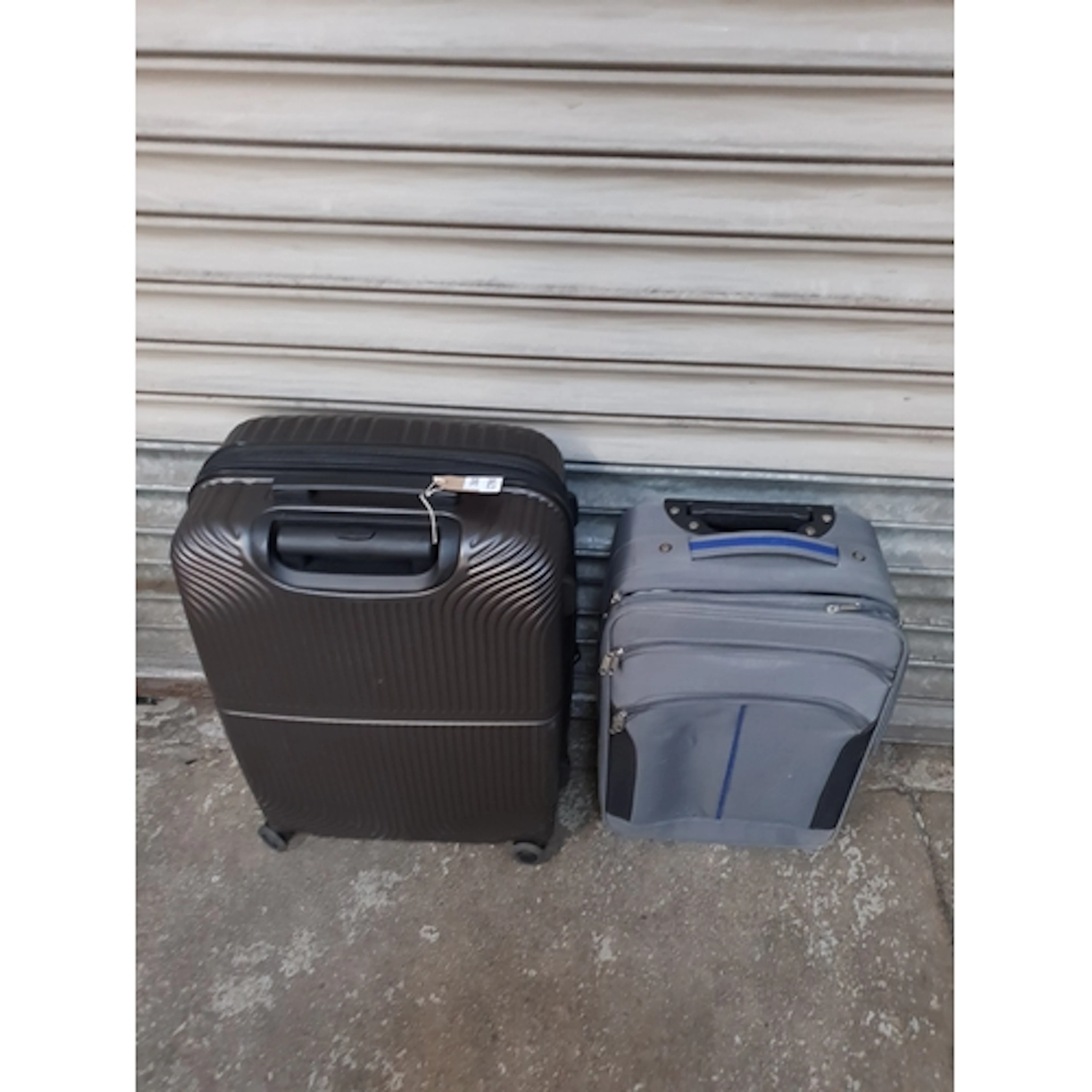 TWO SUITCASES including Explore Note: cases and bags are emp...