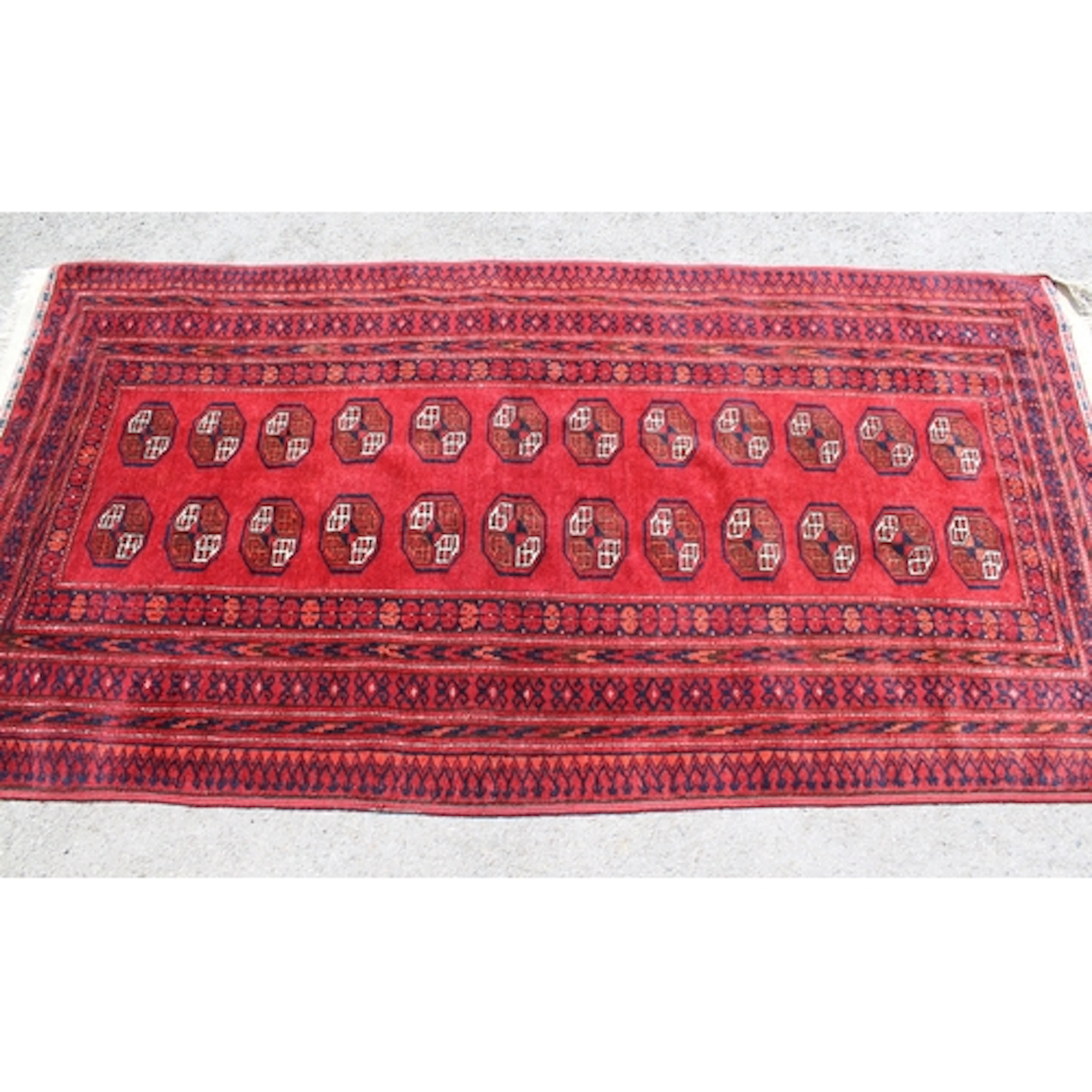 20th Century Turkoman rug with two rows of twelve gols on a ...