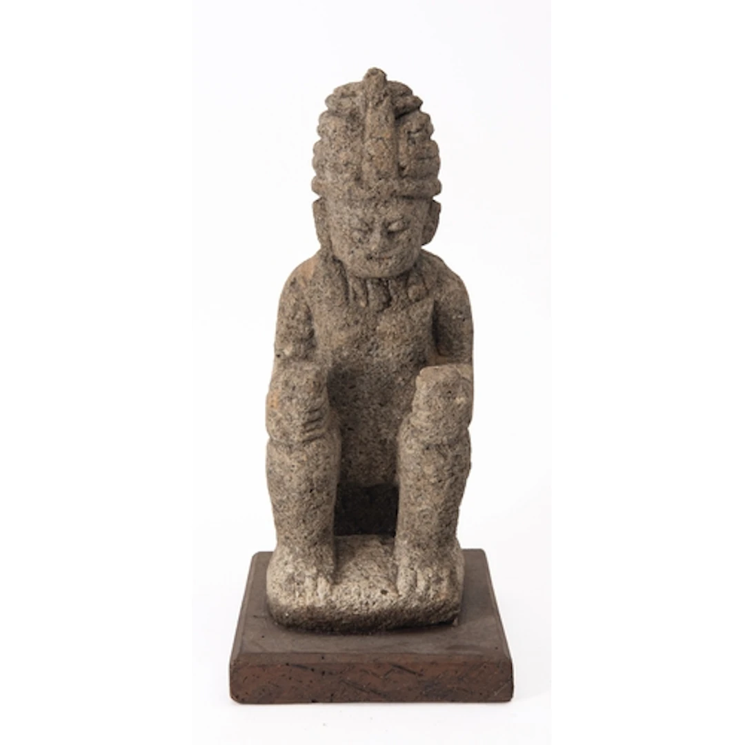 A reproduction Mesoamerican chac mool model of a reclining f...