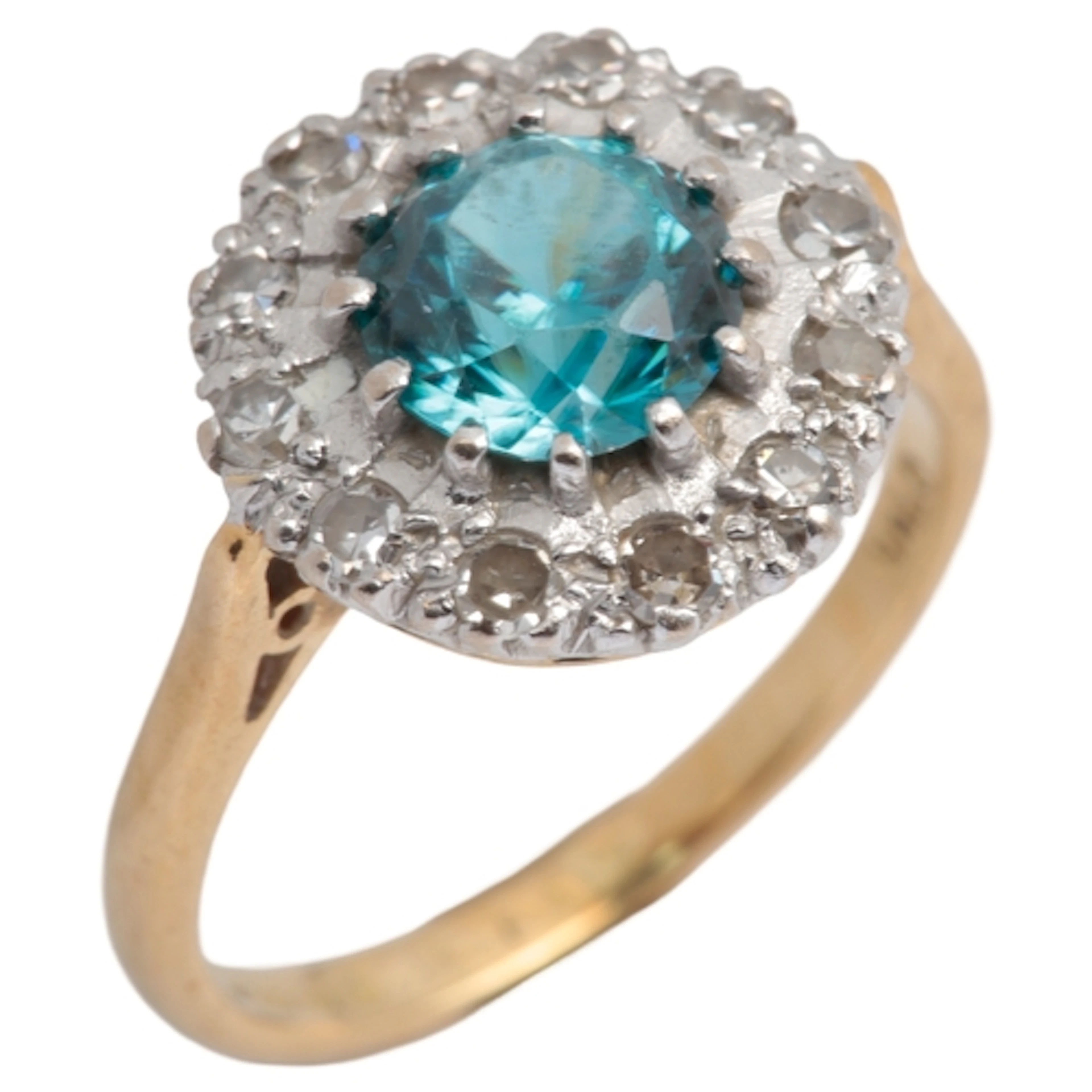A zircon and diamond cluster ring, claw-set with a brilliant...