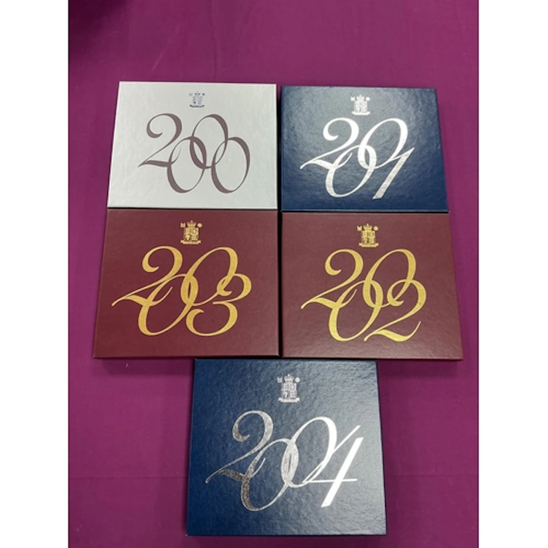 Five Royal Mint Proof Annual Coin Sets, 2000 to 2004.