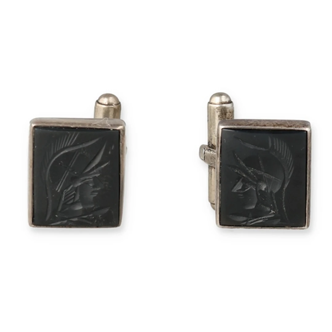 A PAIR OF SILVER CARVED JET CENTURION CUFFLINKS