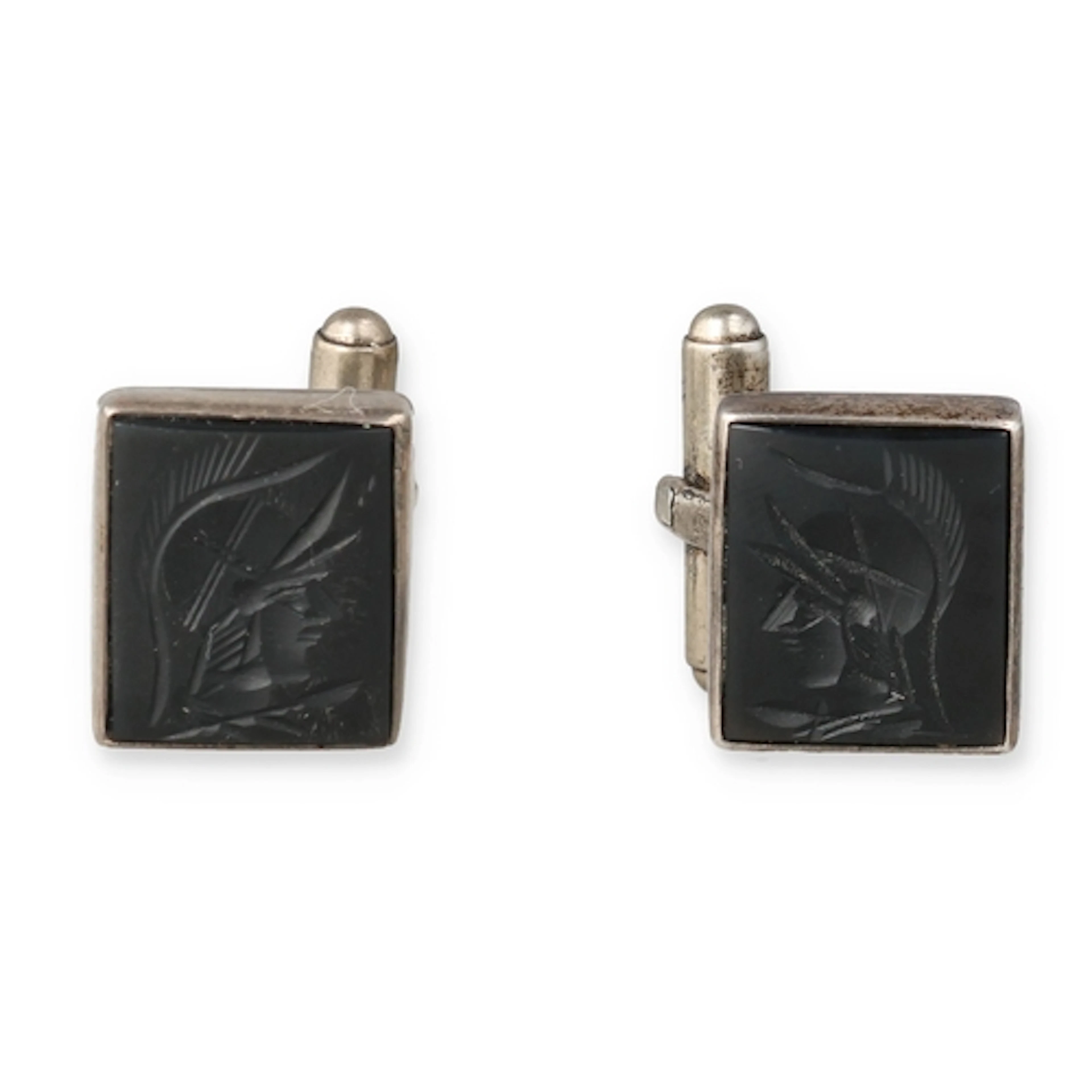 A PAIR OF SILVER CARVED JET CENTURION CUFFLINKS